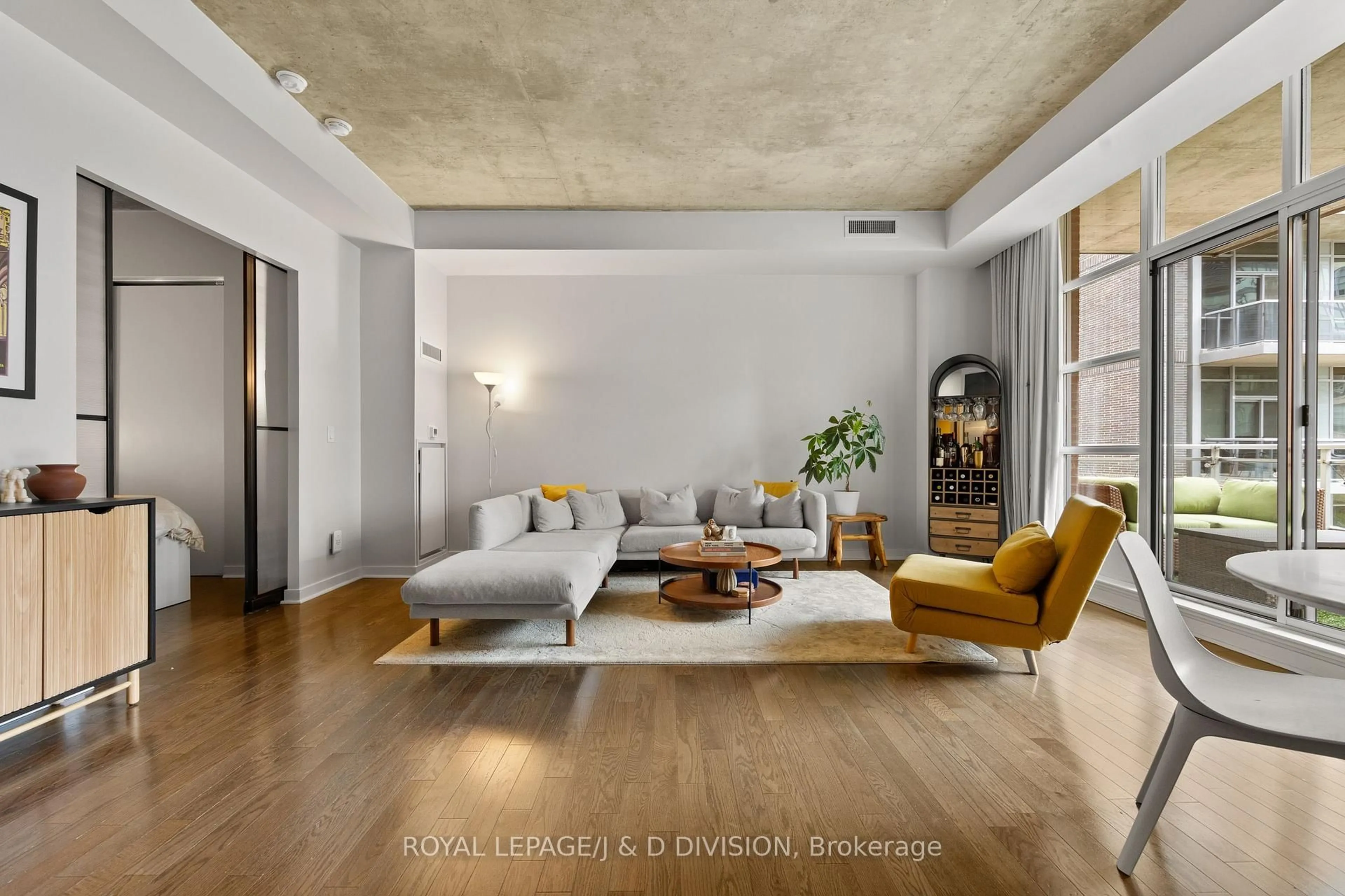 Living room with furniture, cement floor for 19 Brant St #508, Toronto Ontario M5V 2L2