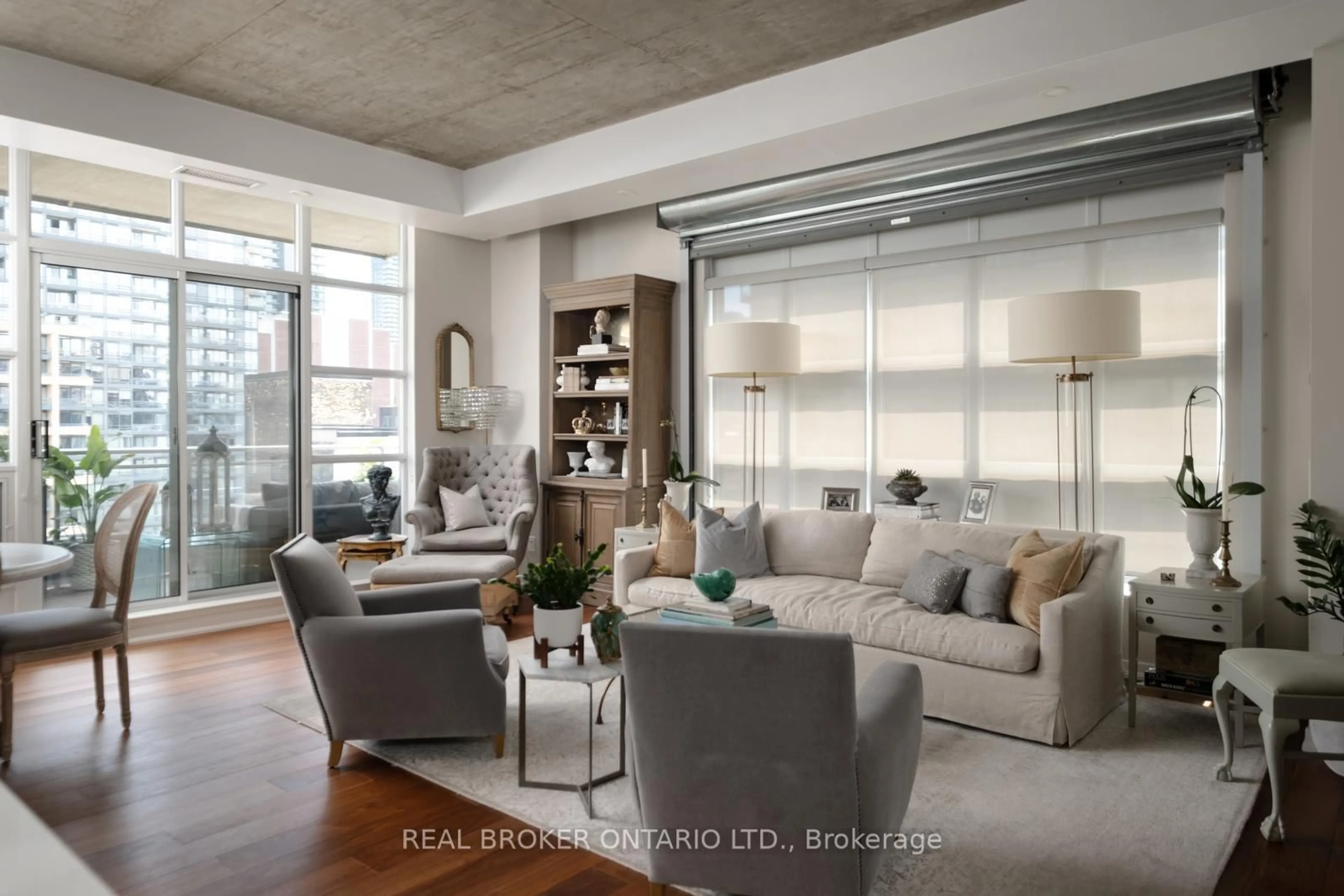 Living room with furniture, cement floor for 23 Brant St #803, Toronto Ontario M5V 2L5