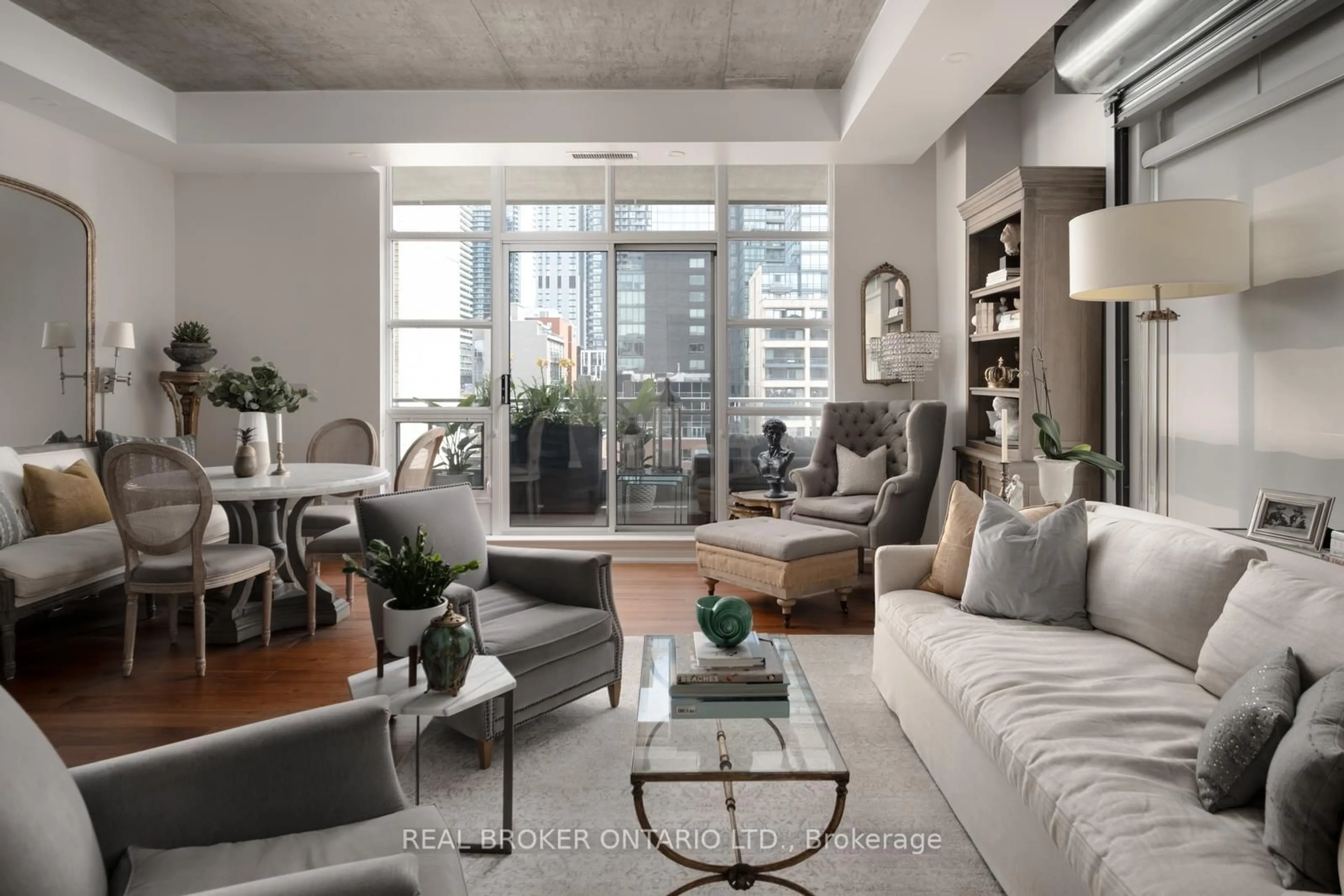 Living room with furniture, cement floor for 23 Brant St #803, Toronto Ontario M5V 2L5
