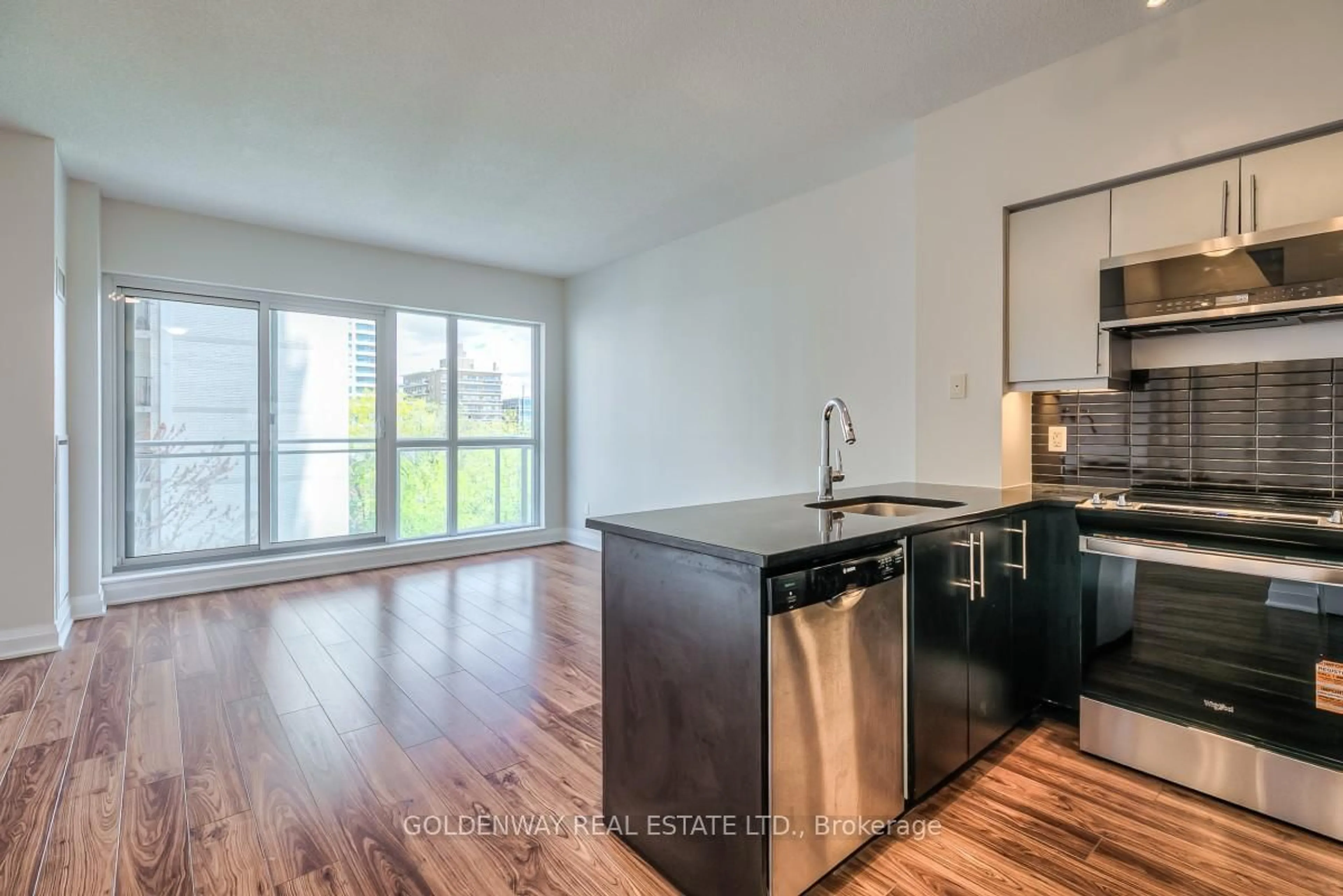 Open concept kitchen, wood/laminate floor for 83 Redpath Ave #401, Toronto Ontario M4S 0A2