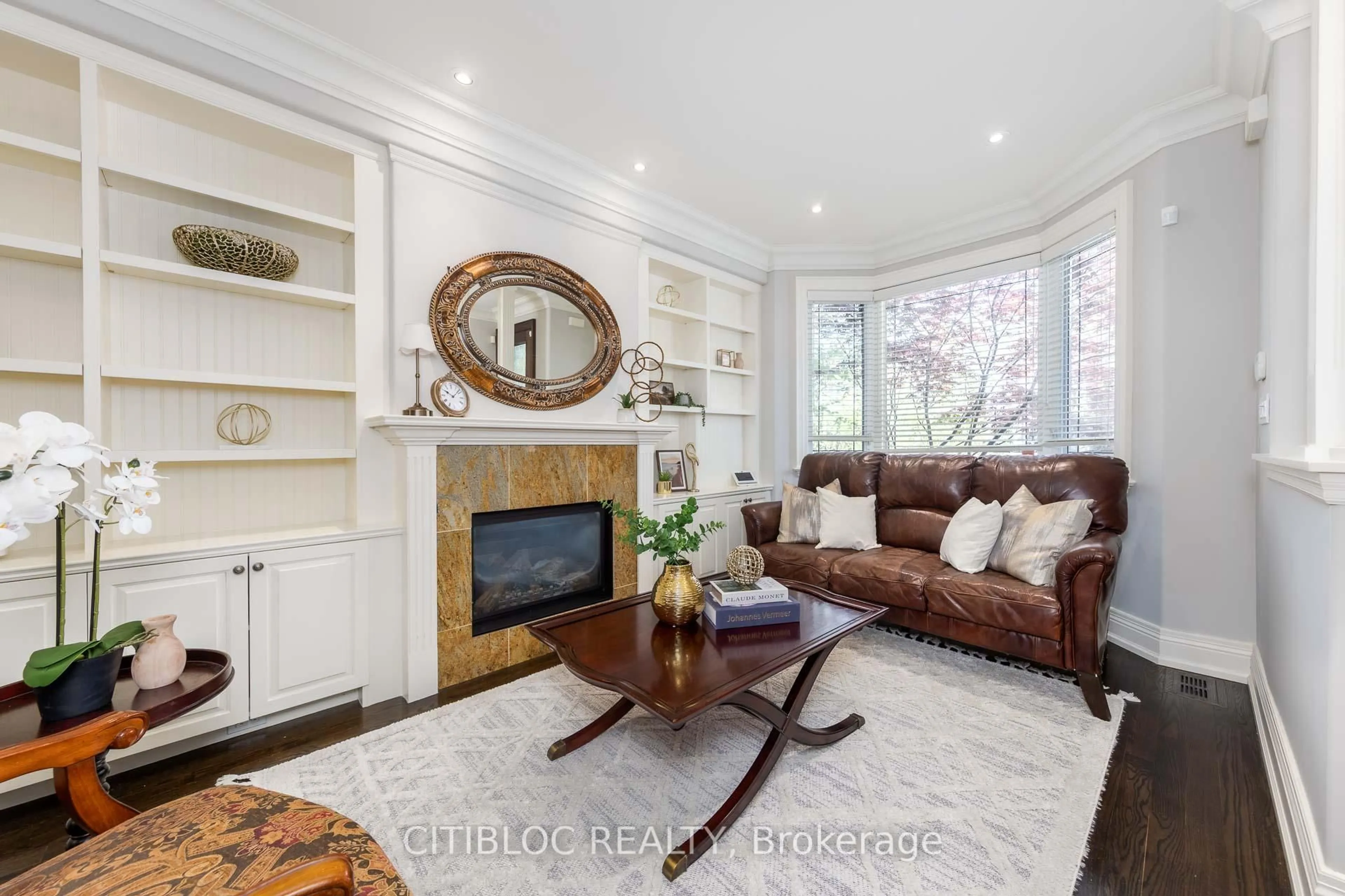 Living room with furniture, wood/laminate floor for 599 Woburn Ave, Toronto Ontario M5M 1M2
