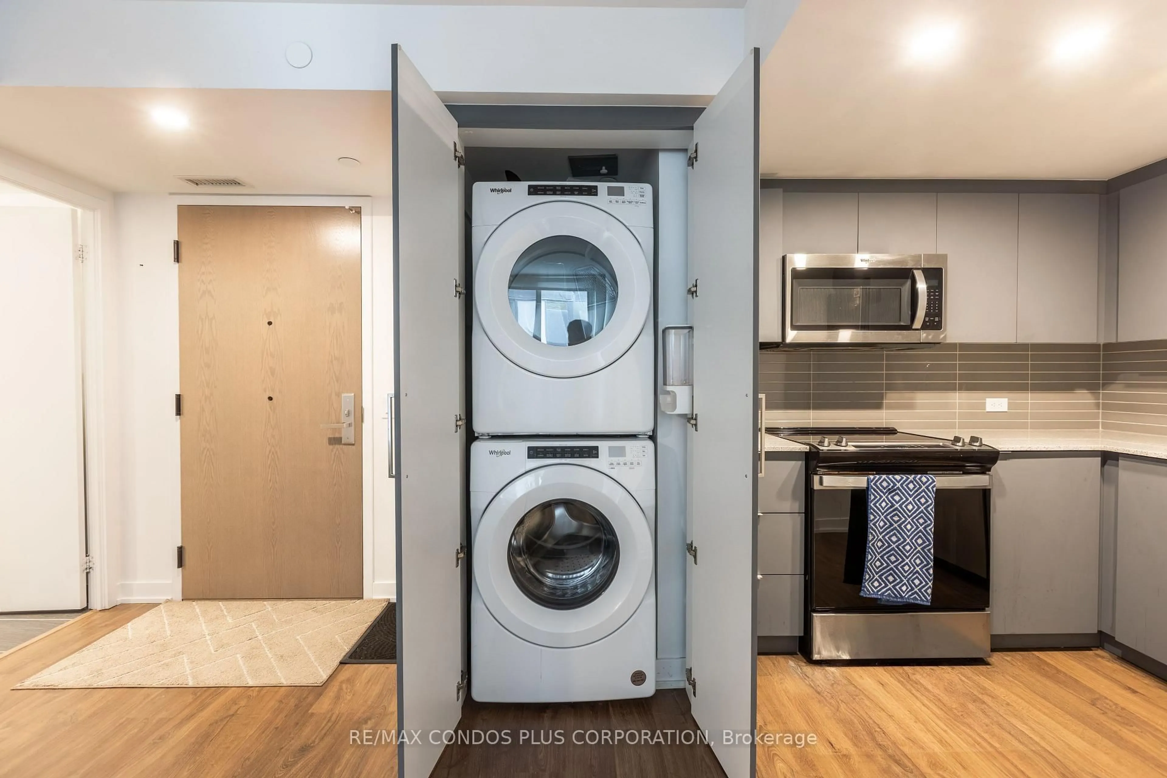 Kitchen with laundary machines, unknown for 30 Tretti Way #311, Toronto Ontario M3H 0E3