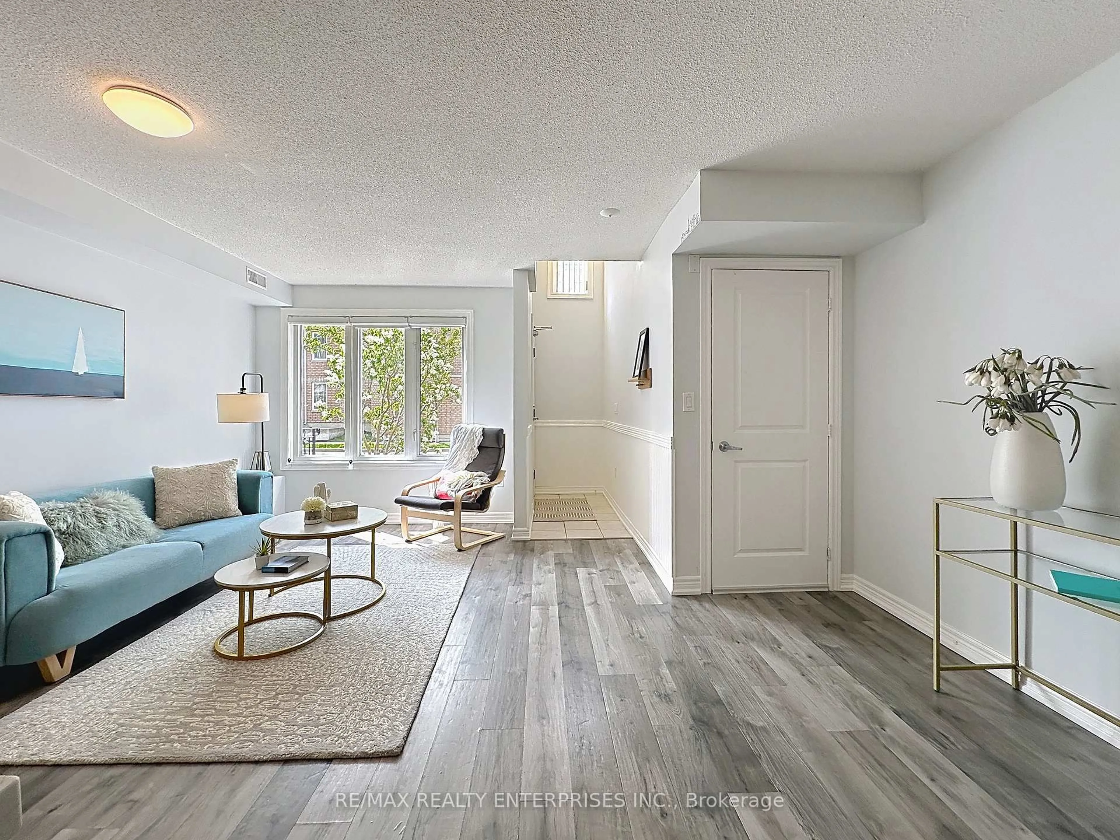 Living room with furniture, unknown for 52 Aerodrome Cres #102, Toronto Ontario M4G 4J1