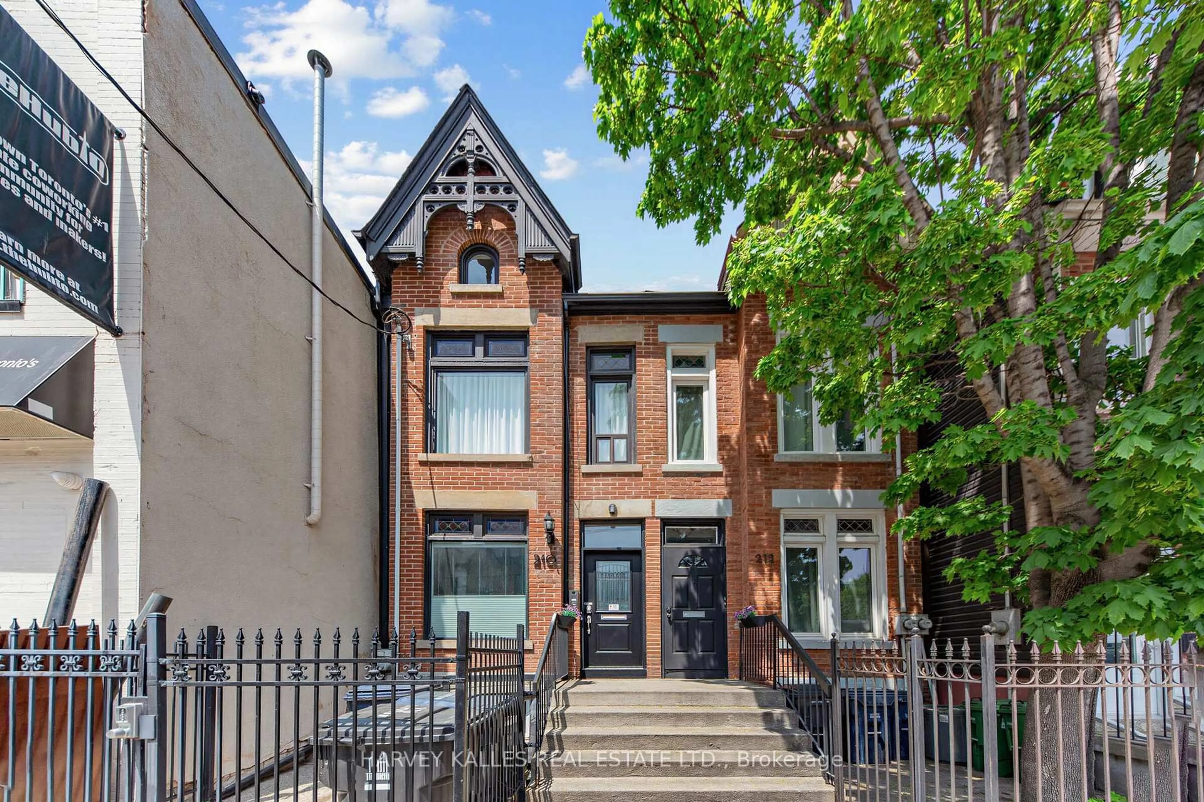 Home with brick exterior material, street for 210 Gerrard St, Toronto Ontario M5A 2E6