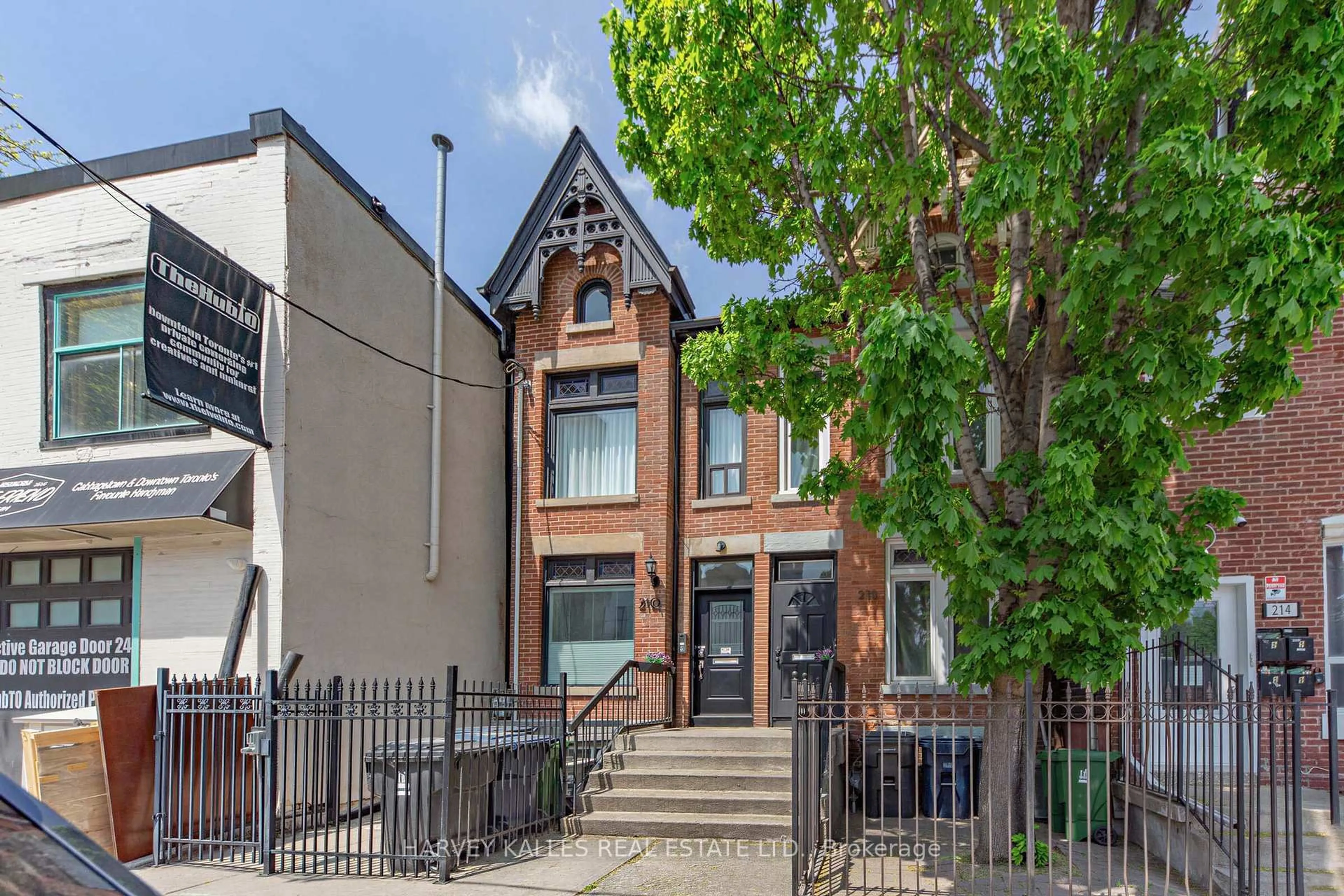Home with brick exterior material, street for 210 Gerrard St, Toronto Ontario M5A 2E6