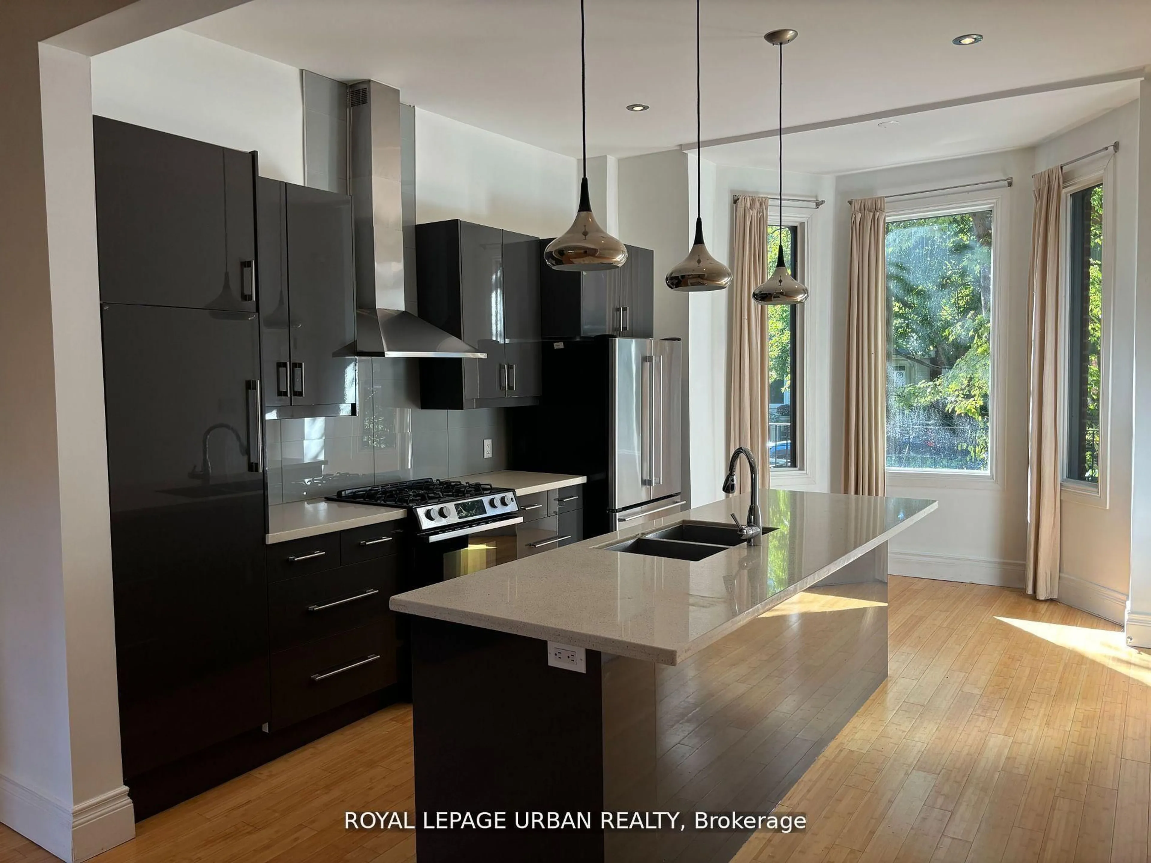Contemporary kitchen, wood/laminate floor for 323 Ontario St, Toronto Ontario M5A 2V8