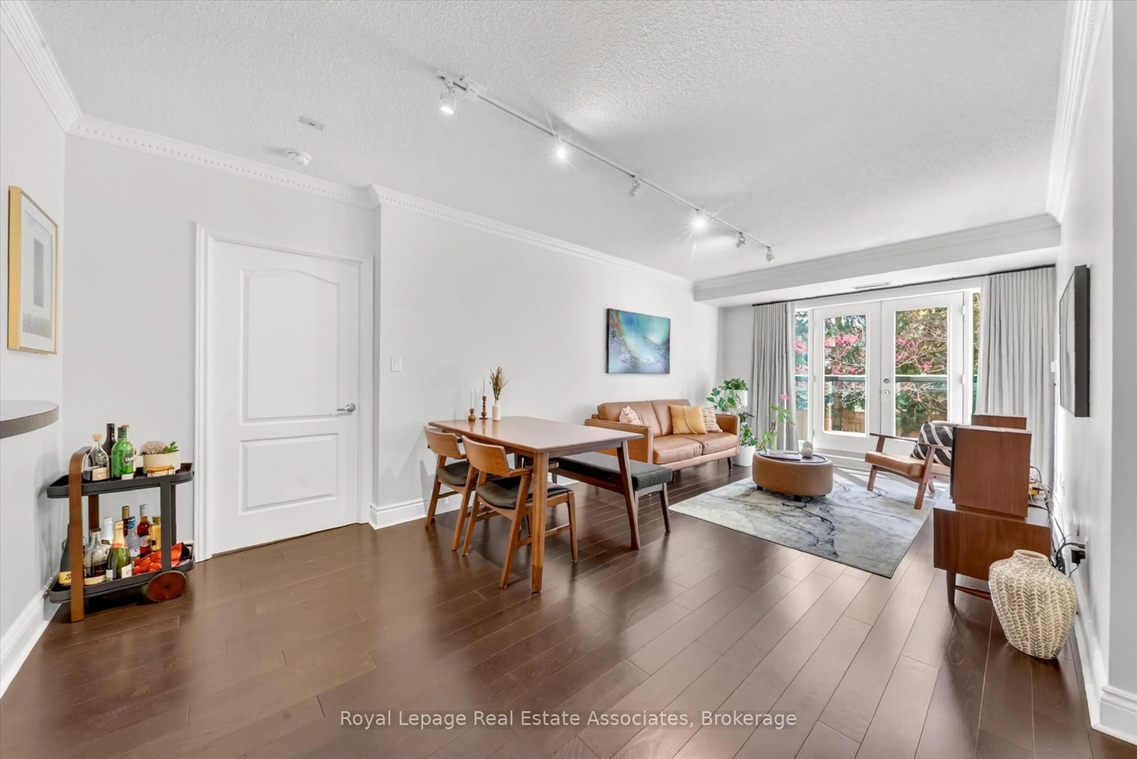 Living room with furniture, wood/laminate floor for 800 Spadina Rd #205, Toronto Ontario M5P 3N2