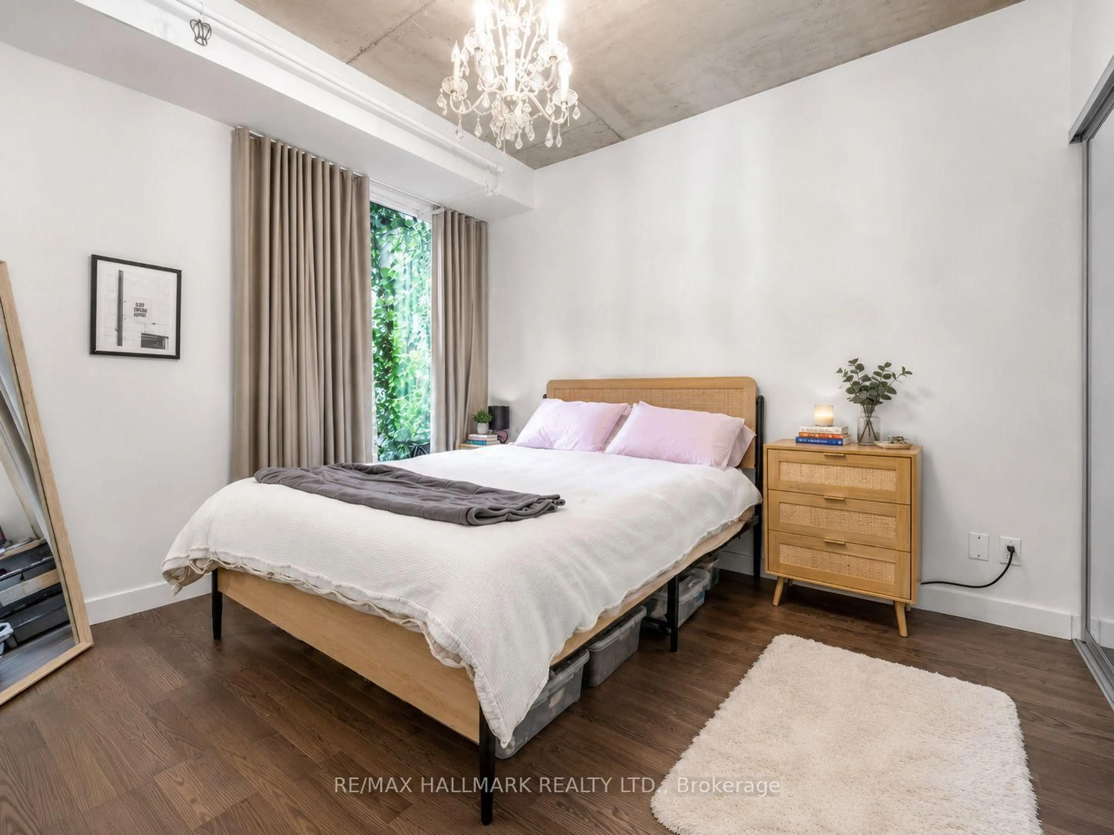 Bedroom with bed, wood/laminate floor for 75 Portland St #213, Toronto Ontario M5V 2M9