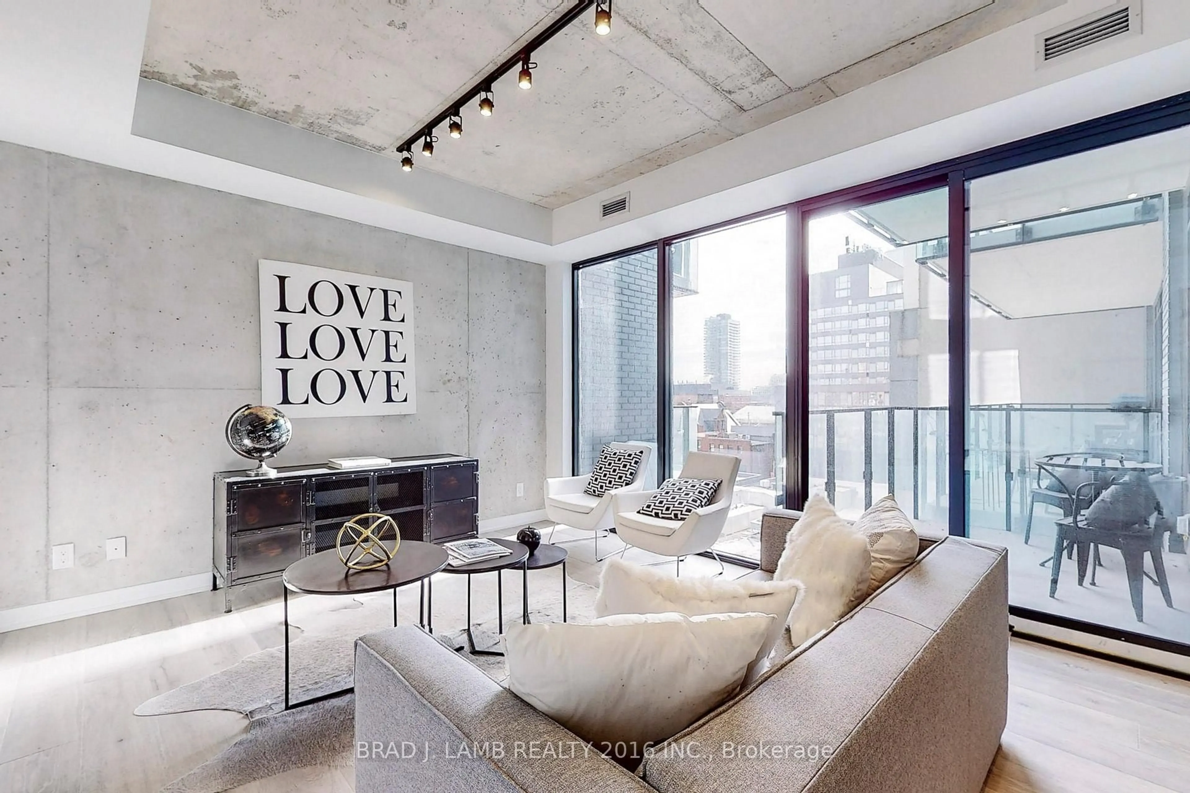 Living room with furniture, cement floor for 55 Ontario St #521, Toronto Ontario M5A 0T8