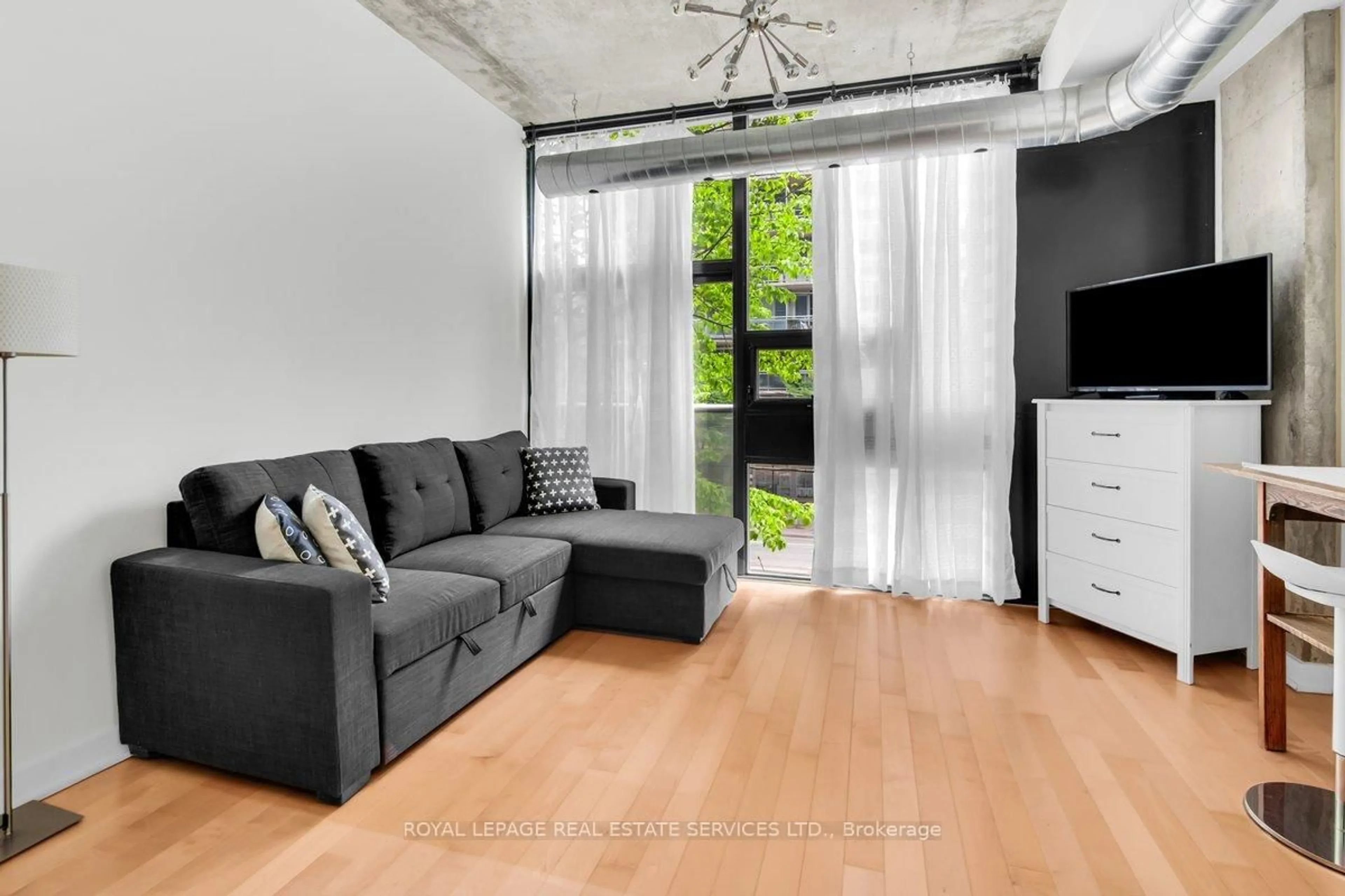 Living room with furniture, unknown for 60 Bathurst St #210, Toronto Ontario M5V 2P7