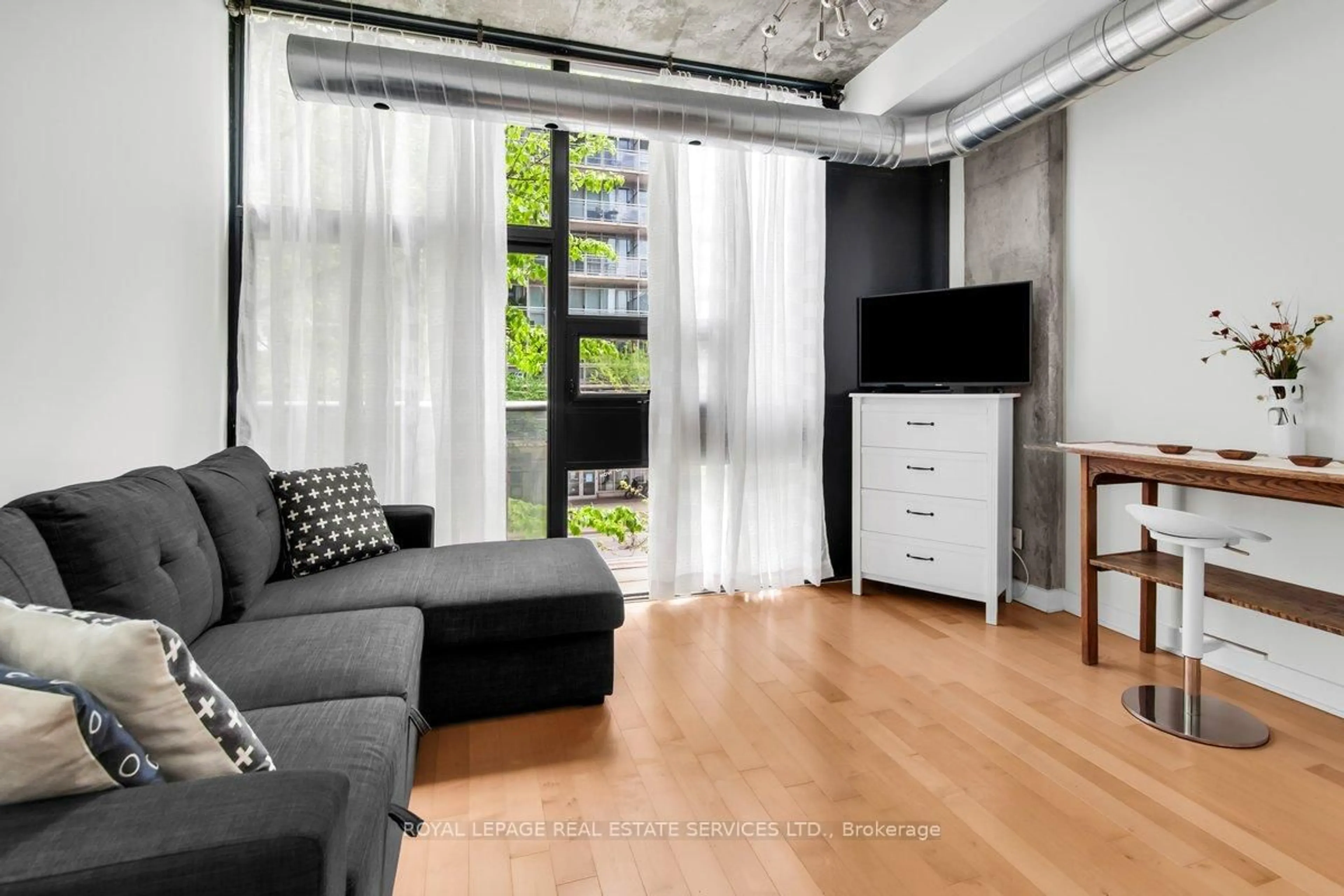 Living room with furniture, unknown for 60 Bathurst St #210, Toronto Ontario M5V 2P7