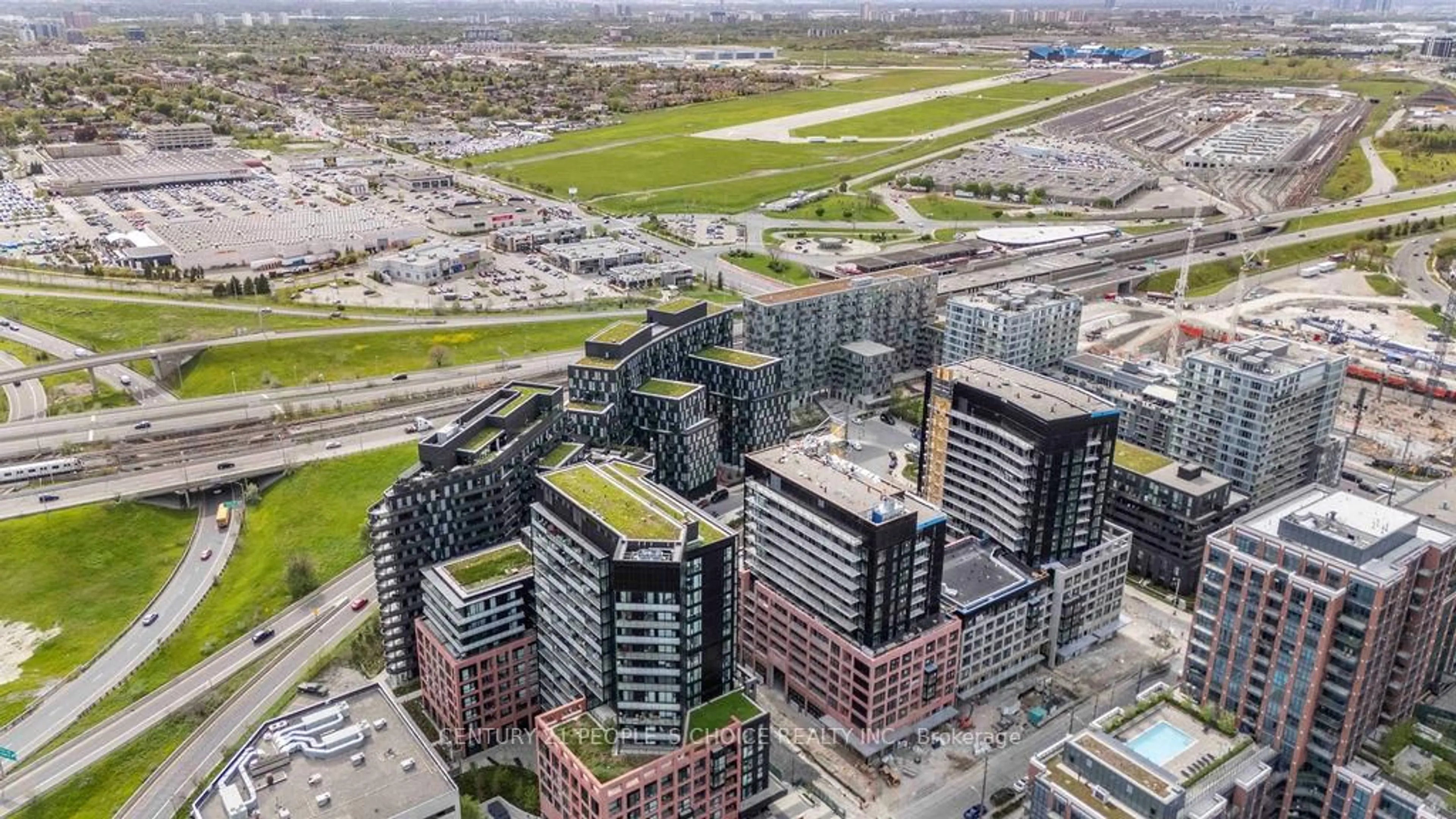 A pic from outside/outdoor area/front of a property/back of a property/a pic from drone, city buildings view from balcony for 30 Tretti Way #1004, Toronto Ontario M3H 0E3