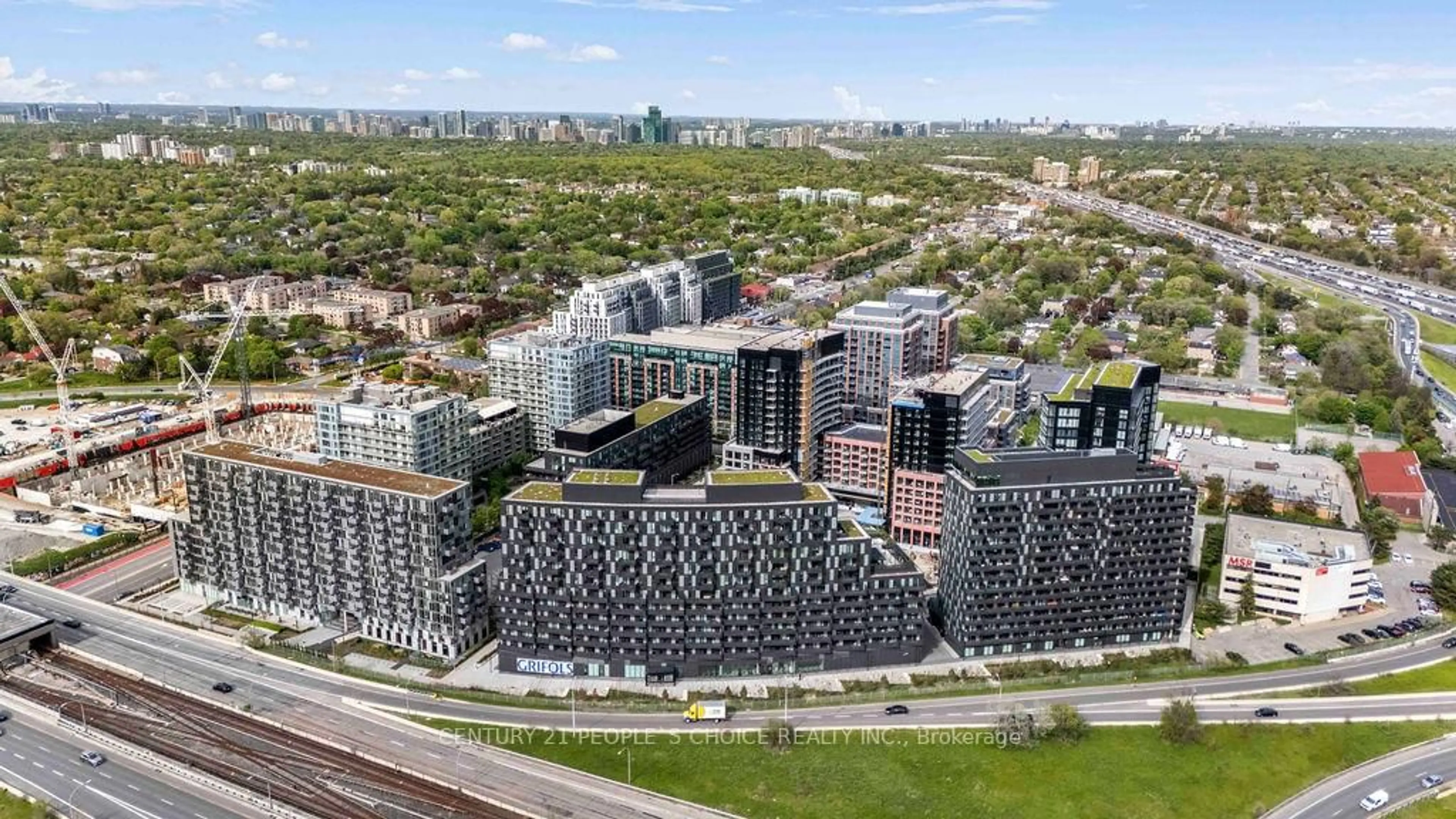A pic from outside/outdoor area/front of a property/back of a property/a pic from drone, city buildings view from balcony for 30 Tretti Way #1004, Toronto Ontario M3H 0E3
