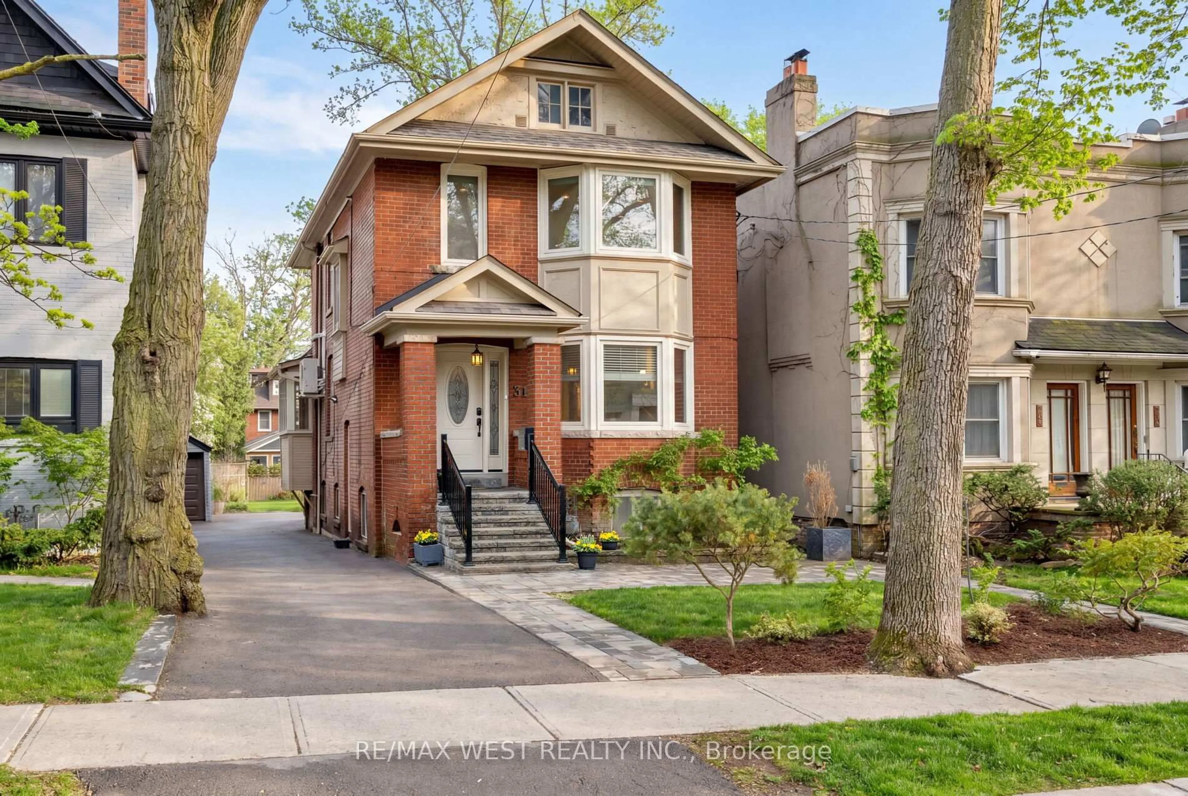 Home with brick exterior material, street for 311 St Clair Ave, Toronto Ontario M4T 1P3