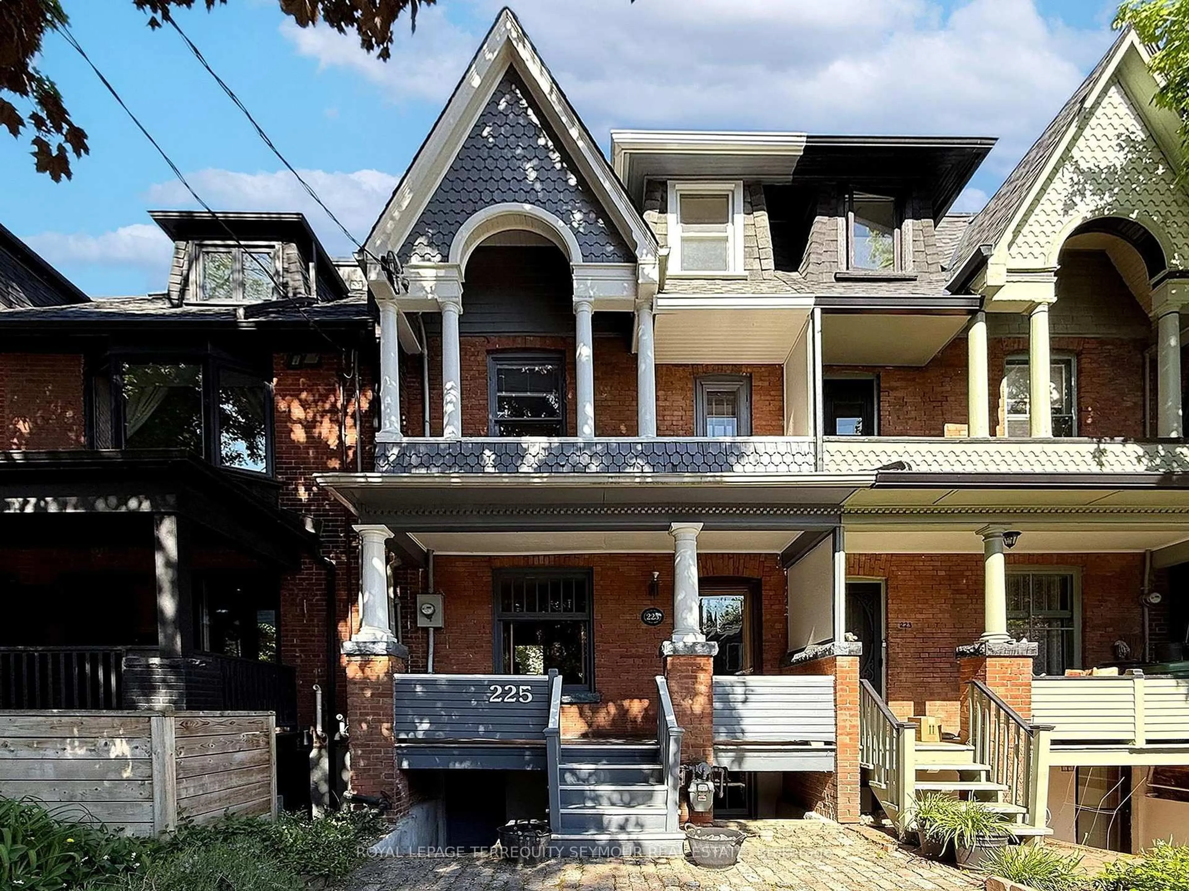 Home with brick exterior material, street for 225 Howland Ave, Toronto Ontario M5R 3B7