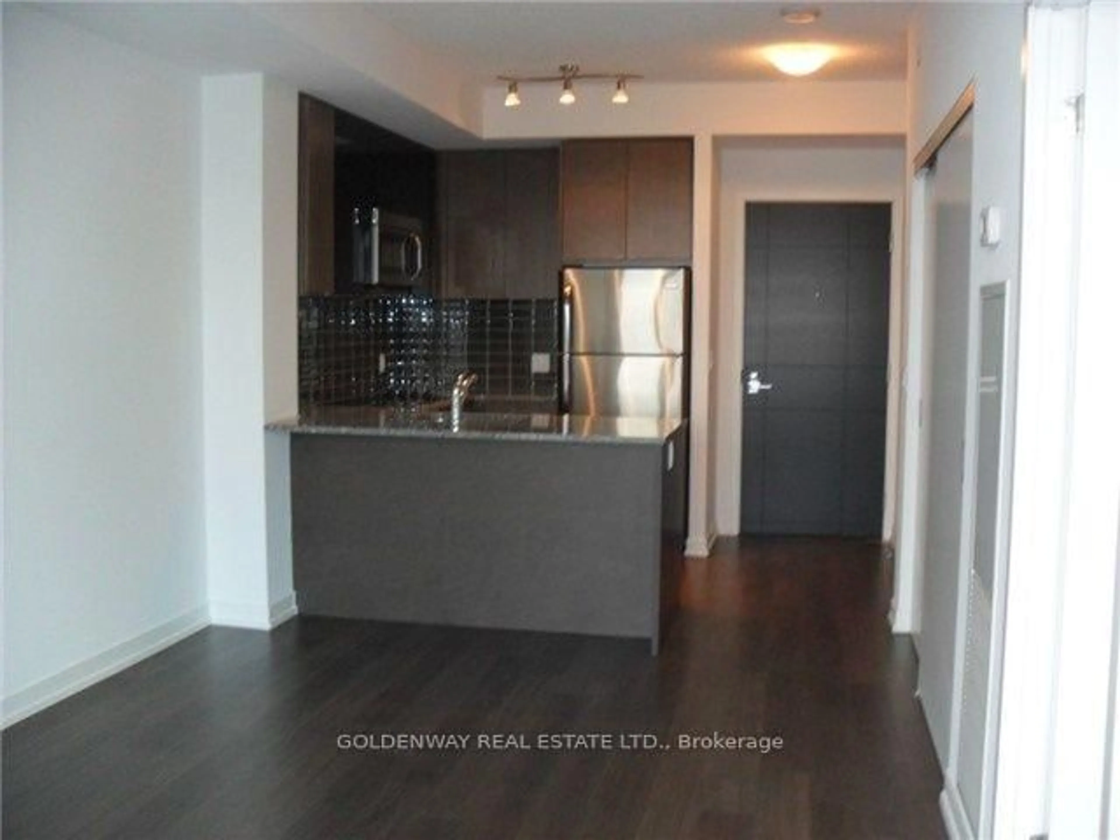 Open concept kitchen, wood/laminate floor for 89 Dunfield Ave #2604, Toronto Ontario M4S 0A4
