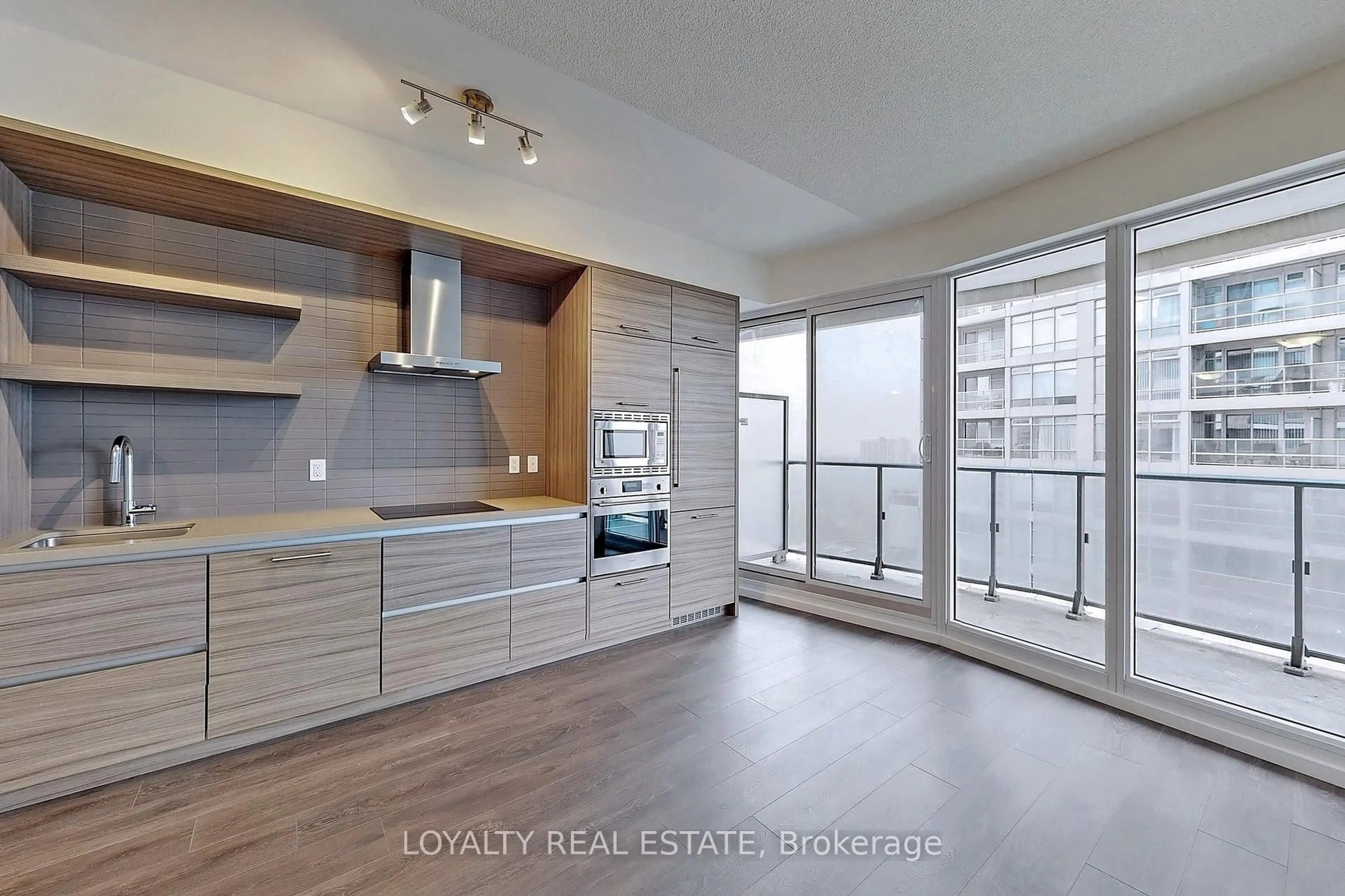 Open concept kitchen, wood/laminate floor for 2221 Yonge St #1705, Toronto Ontario M4S 2B4