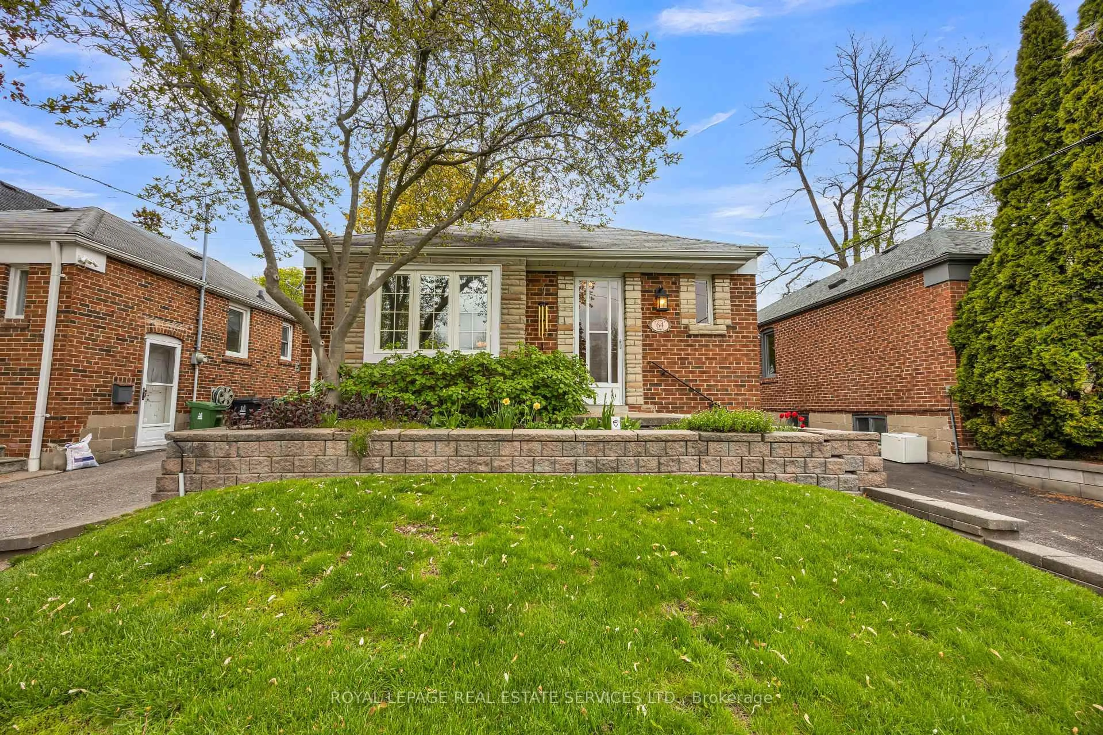 Home with brick exterior material, street for 64 Nesbitt Dr, Toronto Ontario M4W 2G3