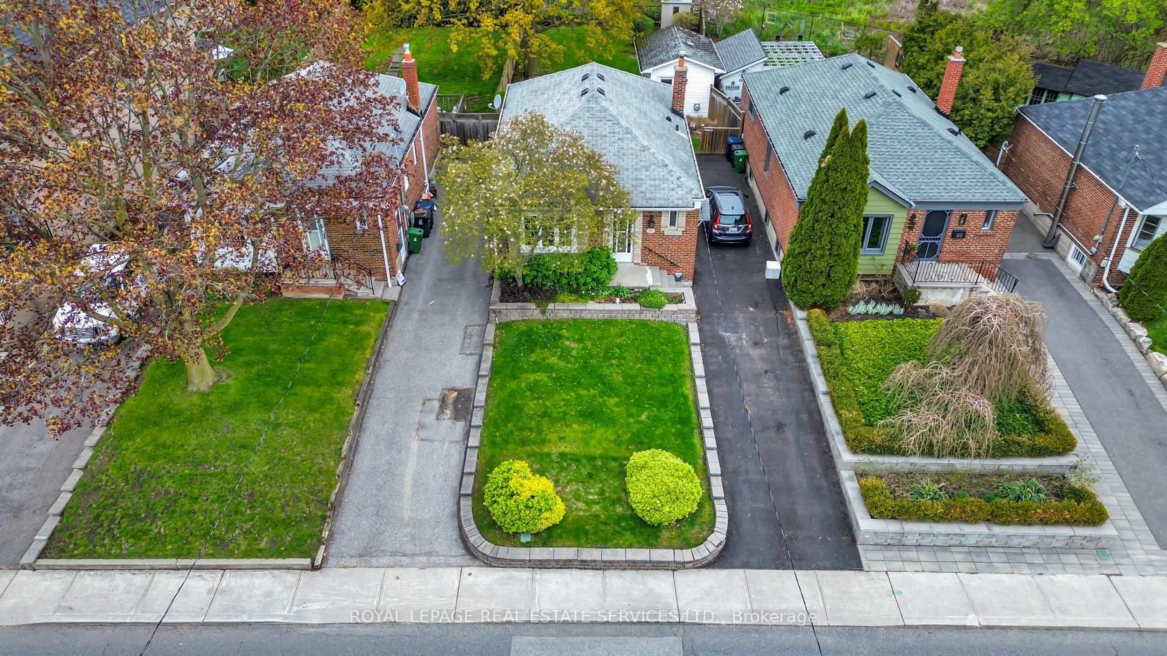 A pic from outside/outdoor area/front of a property/back of a property/a pic from drone, street for 64 Nesbitt Dr, Toronto Ontario M4W 2G3