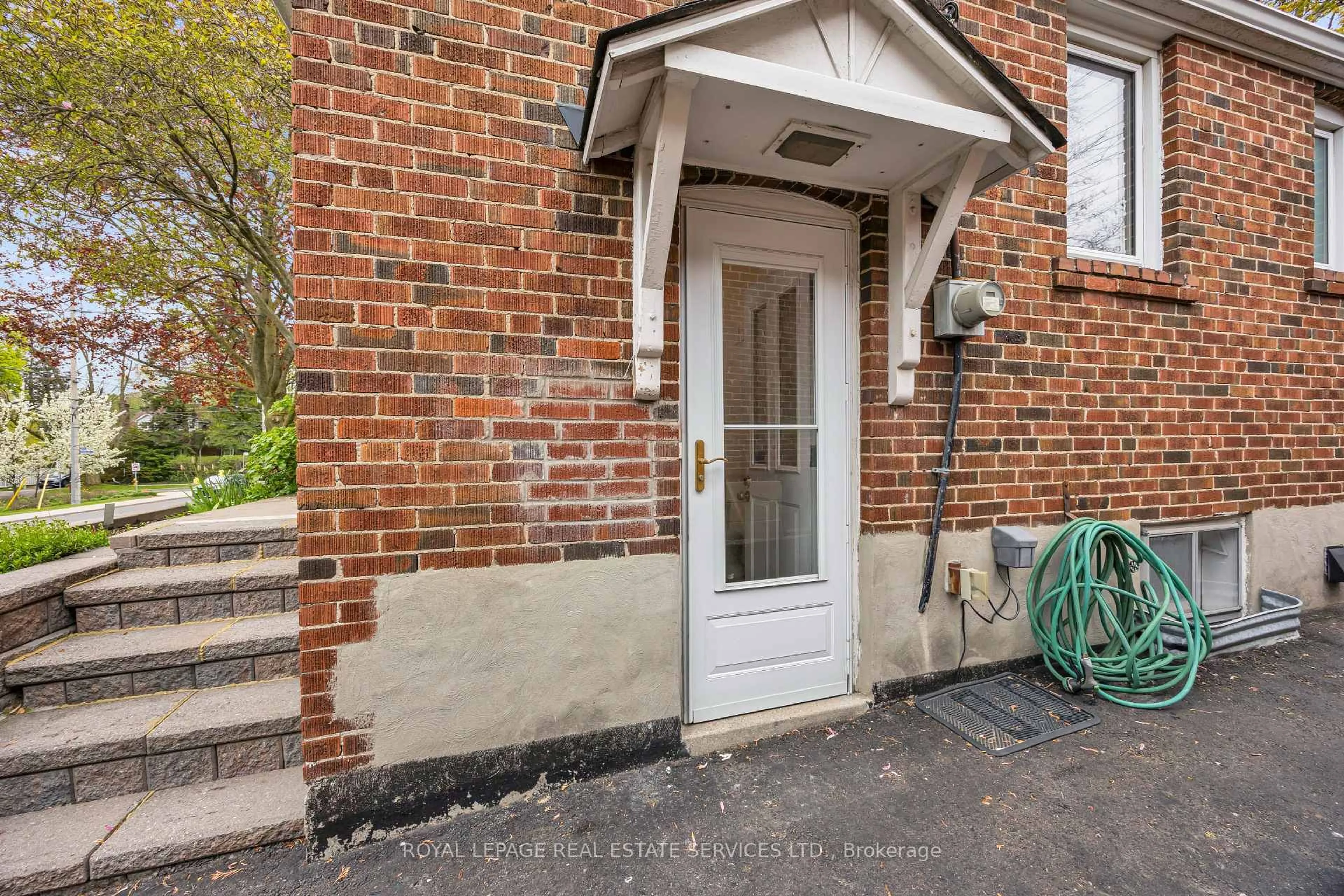 Home with brick exterior material, street for 64 Nesbitt Dr, Toronto Ontario M4W 2G3