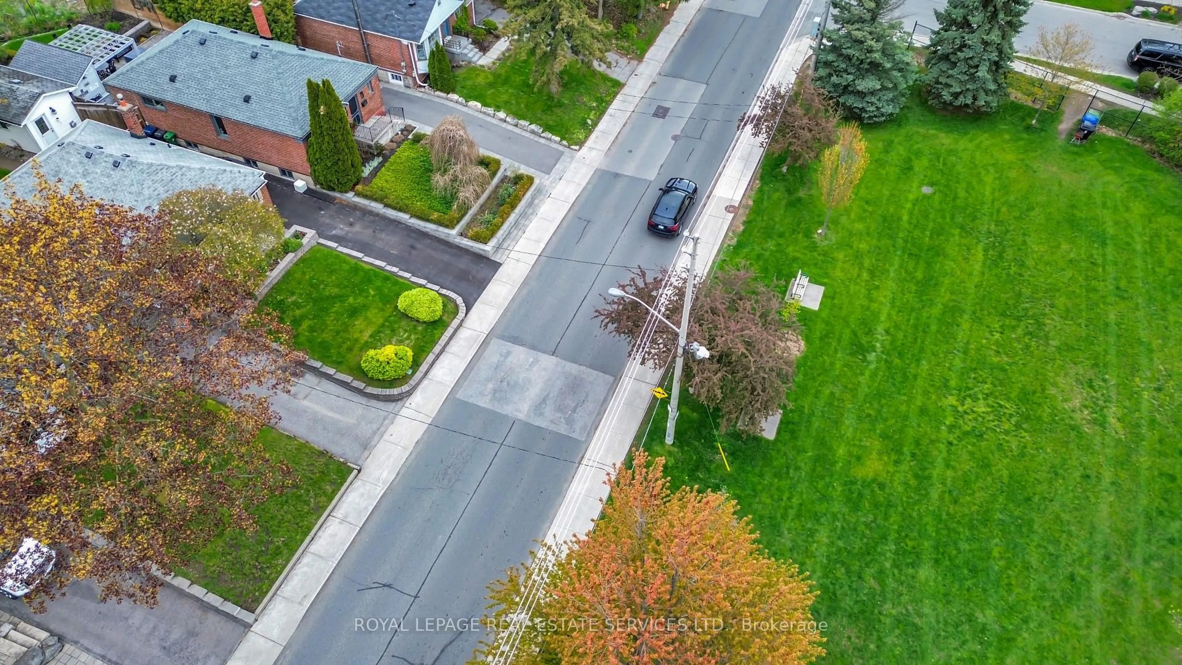 A pic from outside/outdoor area/front of a property/back of a property/a pic from drone, street for 64 Nesbitt Dr, Toronto Ontario M4W 2G3