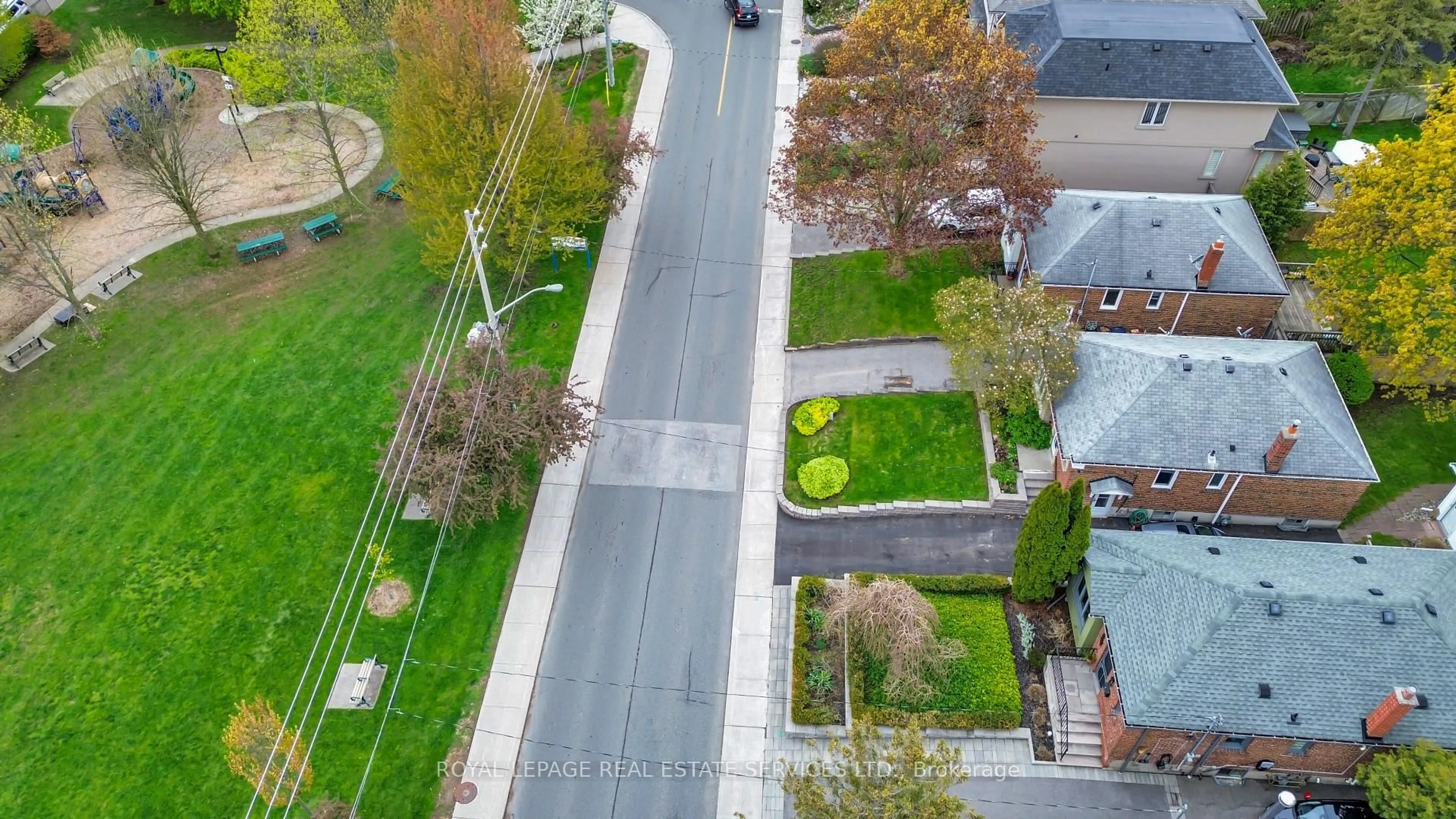 A pic from outside/outdoor area/front of a property/back of a property/a pic from drone, street for 64 Nesbitt Dr, Toronto Ontario M4W 2G3