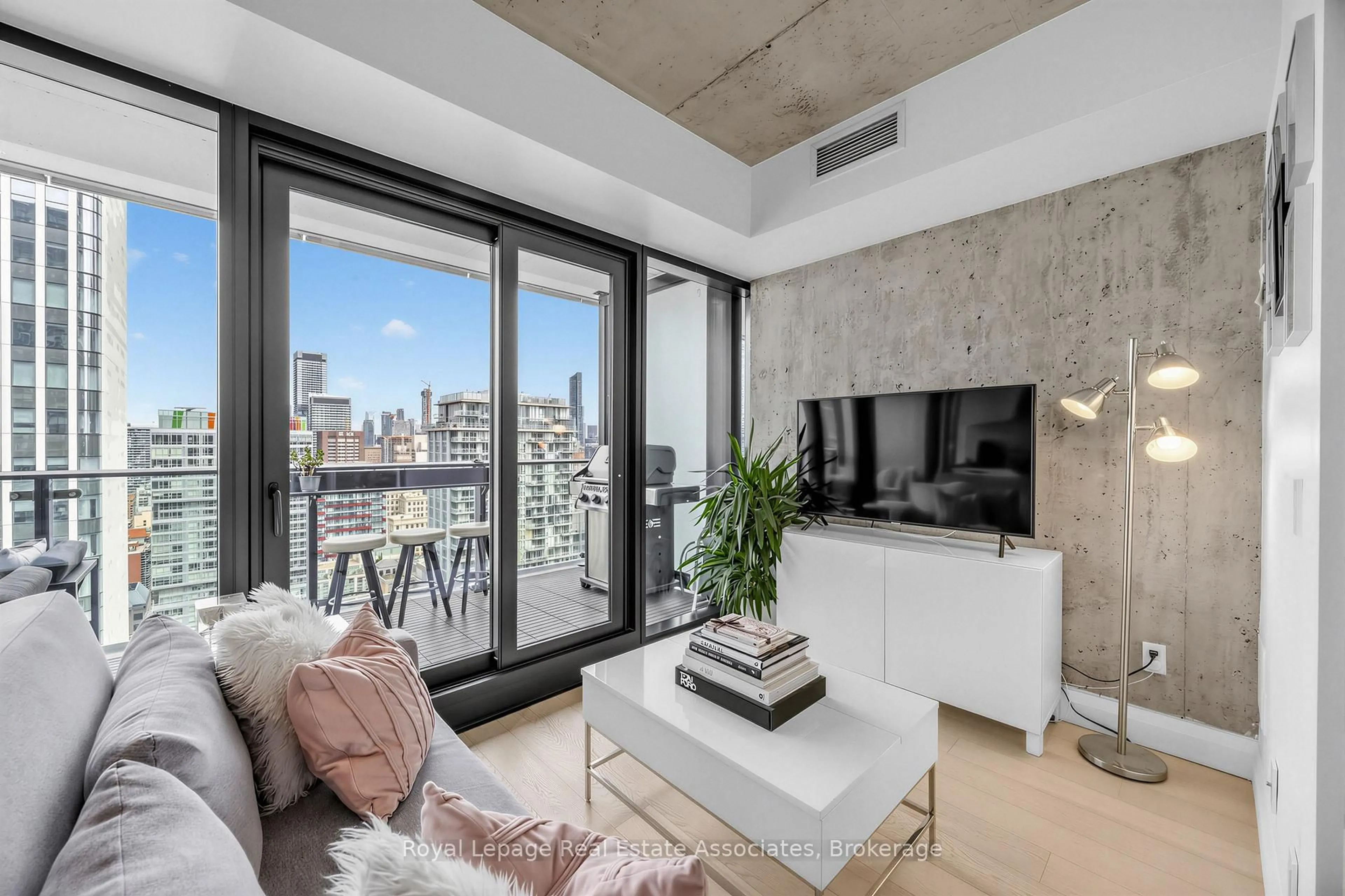 Living room with furniture, cement floor for 224 King St #3102, Toronto Ontario M5H 0A6
