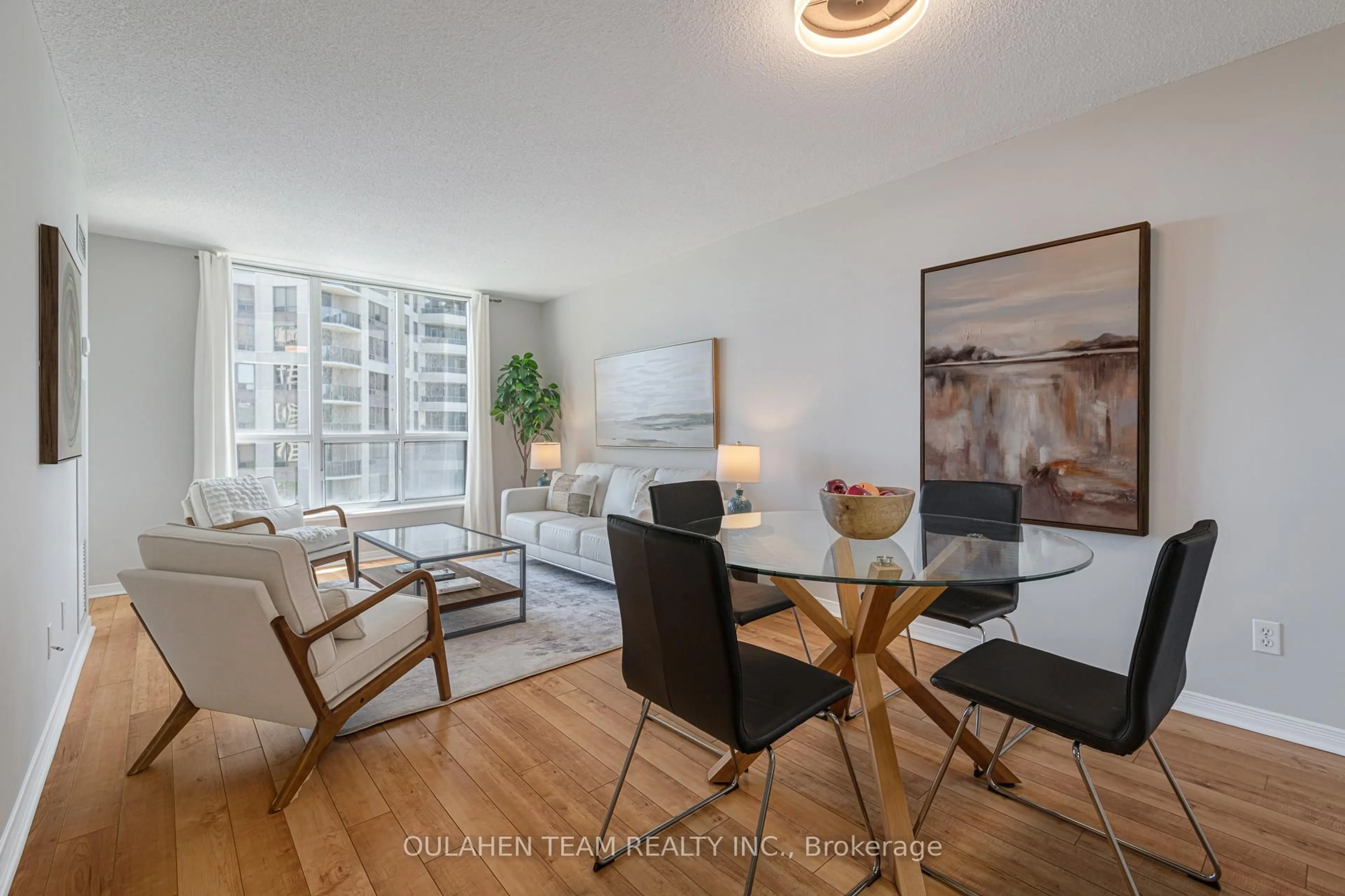 Living room with furniture, wood/laminate floor for 55 Harrison Garden Blvd #704, Toronto Ontario M2N 7G3