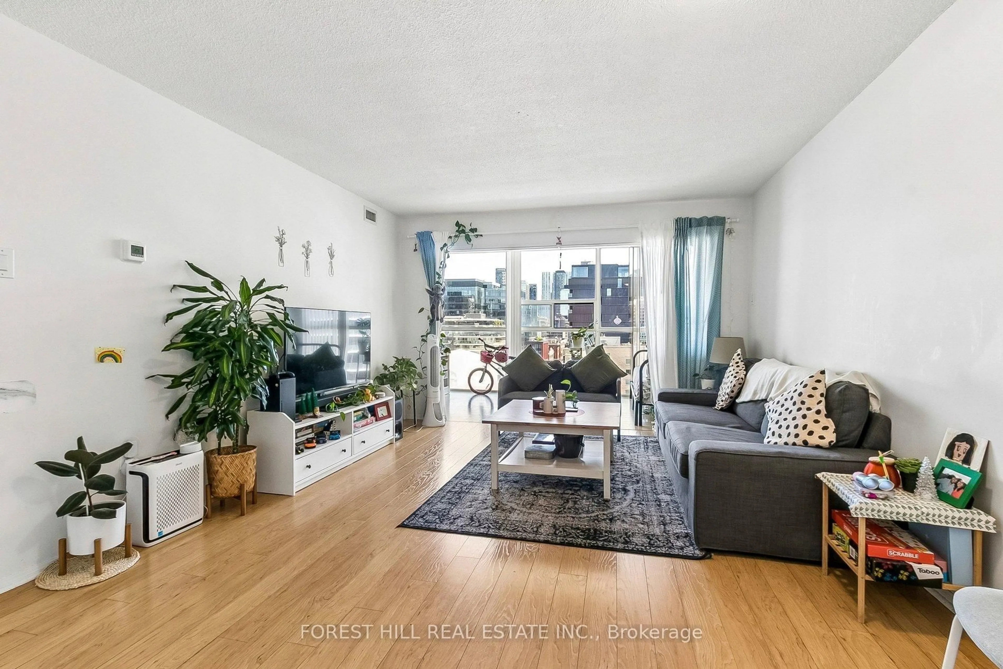 Living room with furniture, wood/laminate floor for 705 King St #1203, Toronto Ontario M5V 2W8