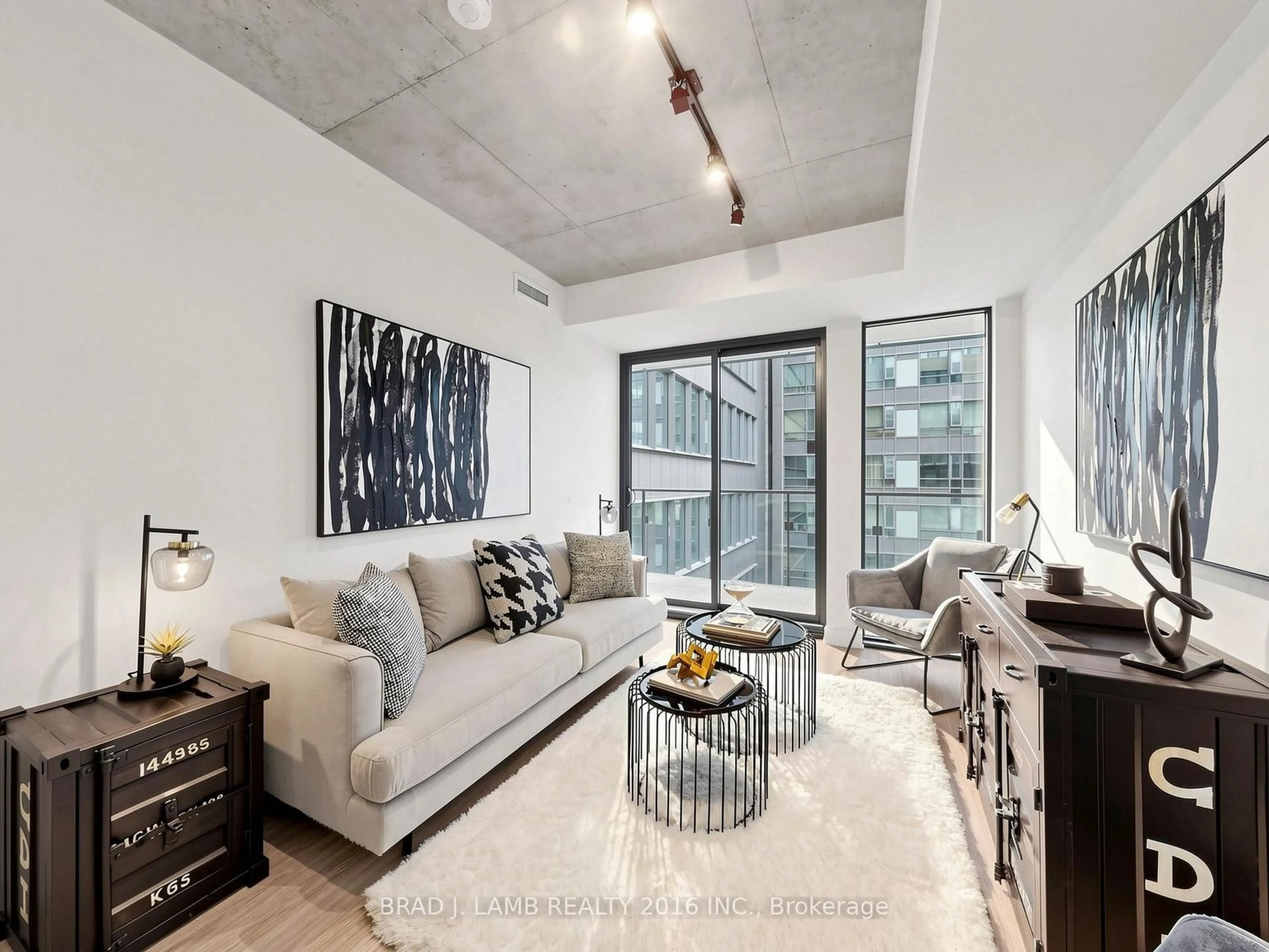 Living room with furniture, cement floor for 284 King St #505, Toronto Ontario M5A 1K4
