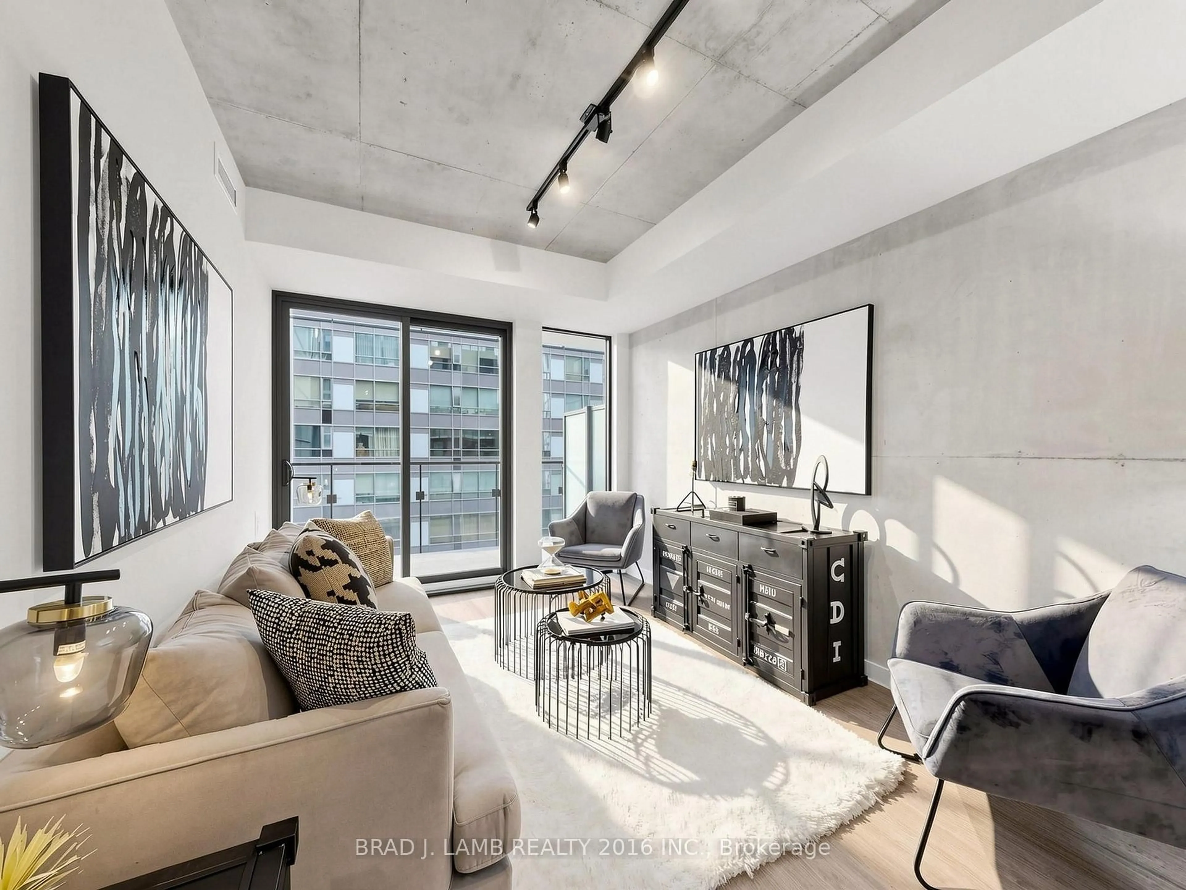 Living room with furniture, cement floor for 284 King St #505, Toronto Ontario M5A 1K4