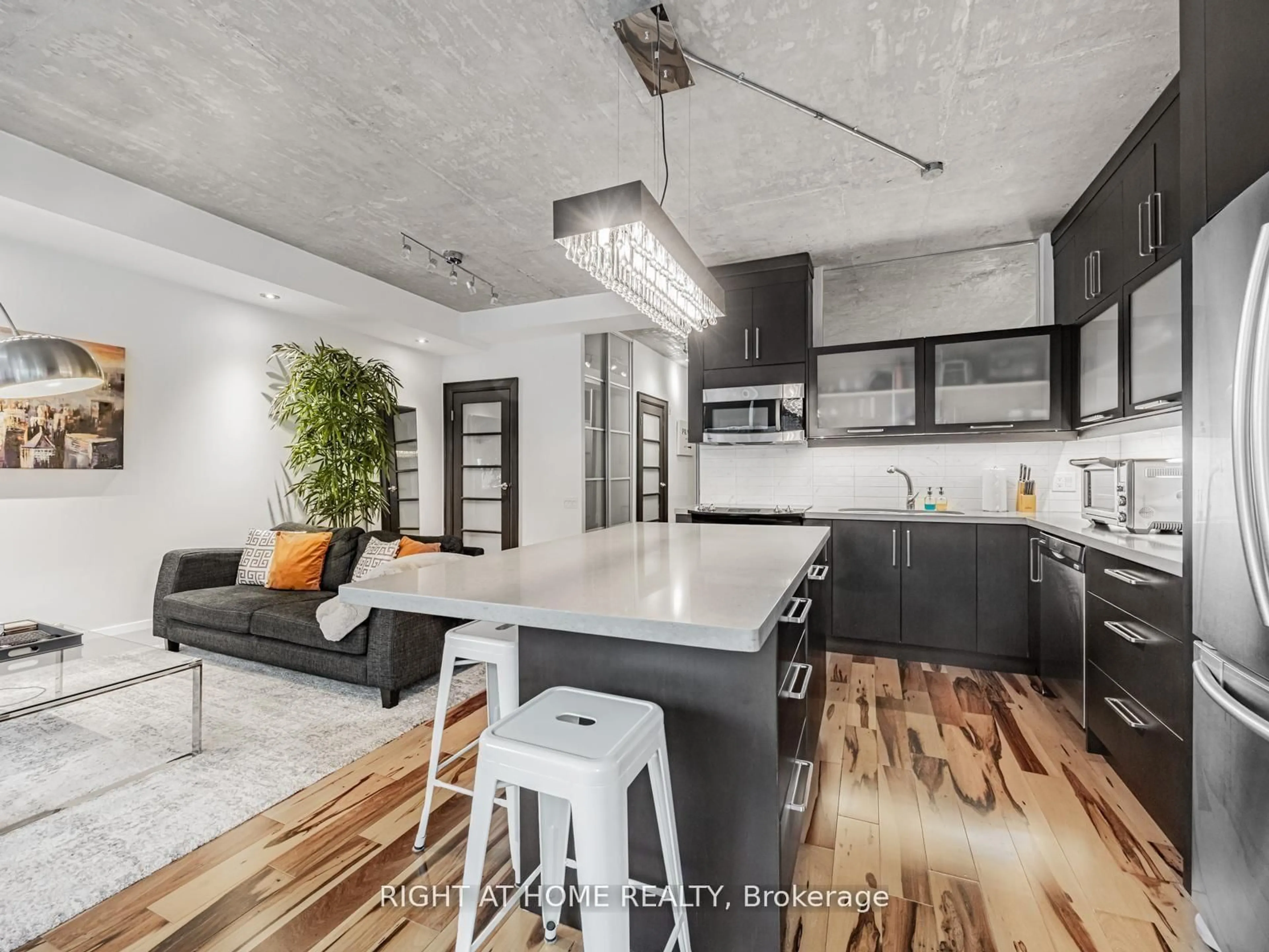 Open concept kitchen, cement floor for 50 Camden St #405, Toronto Ontario M5V 3N1