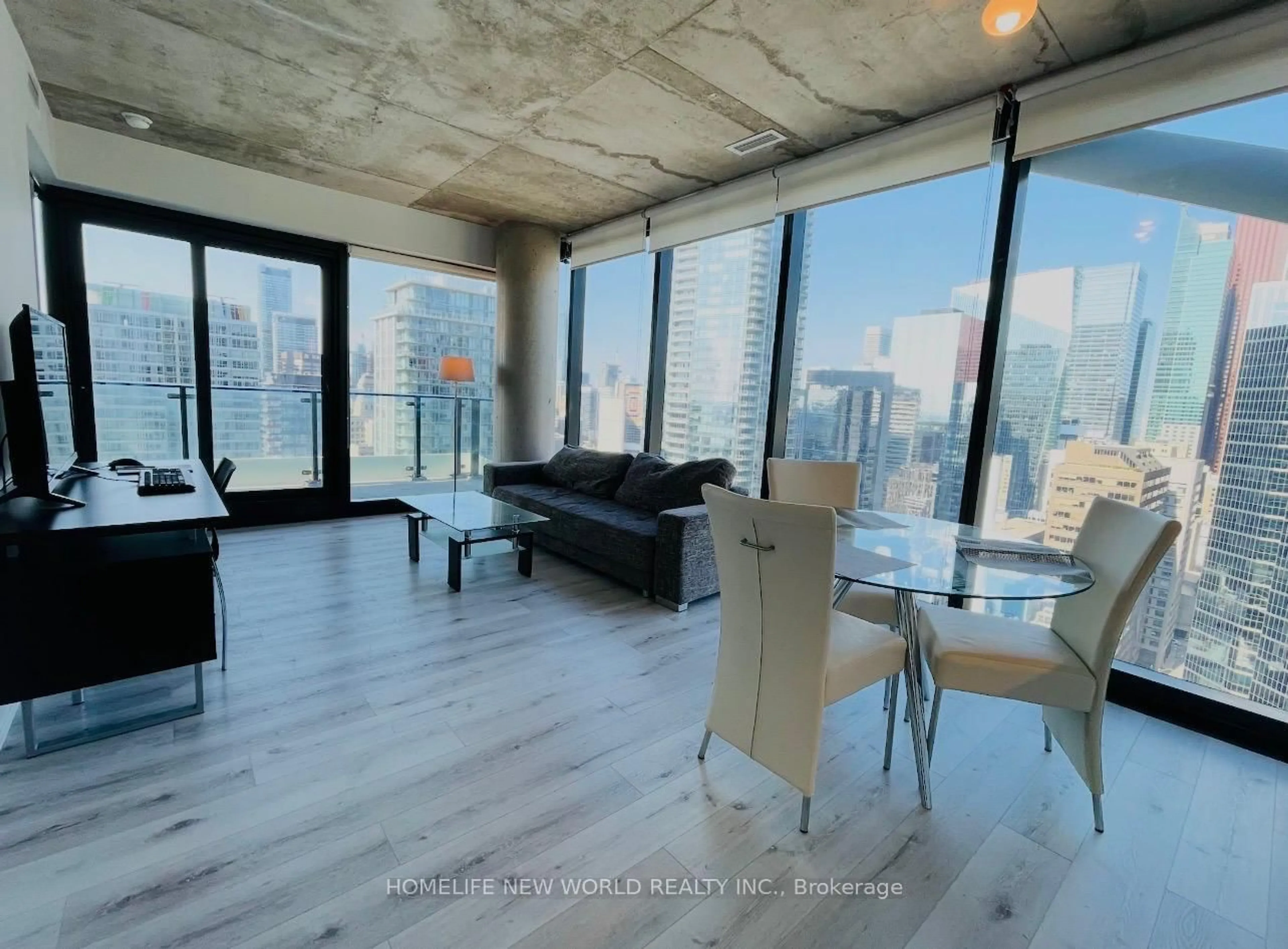 Living room with furniture, cement floor for 224 King St #2703, Toronto Ontario M5H 0A6