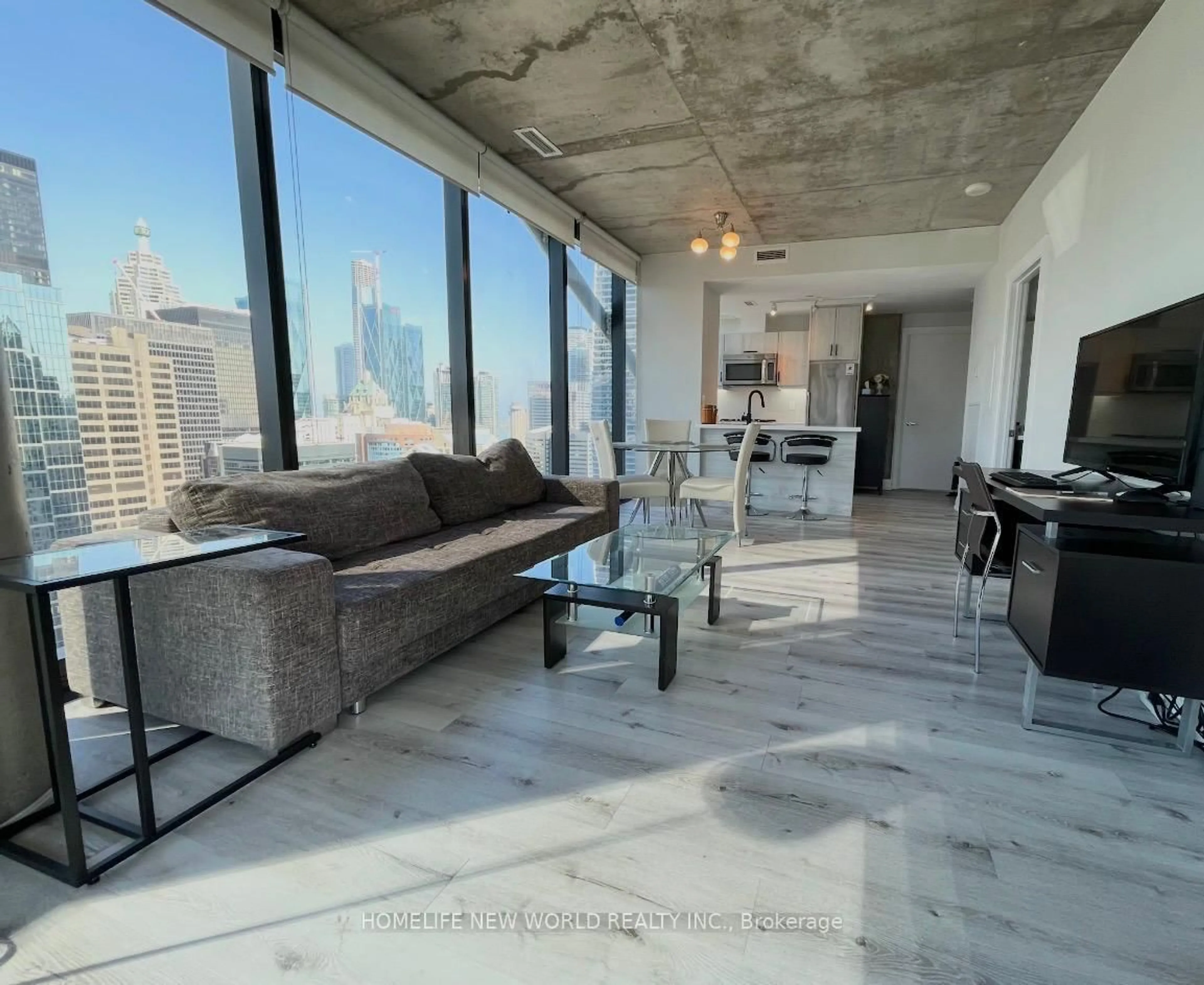 Living room with furniture, cement floor for 224 King St #2703, Toronto Ontario M5H 0A6