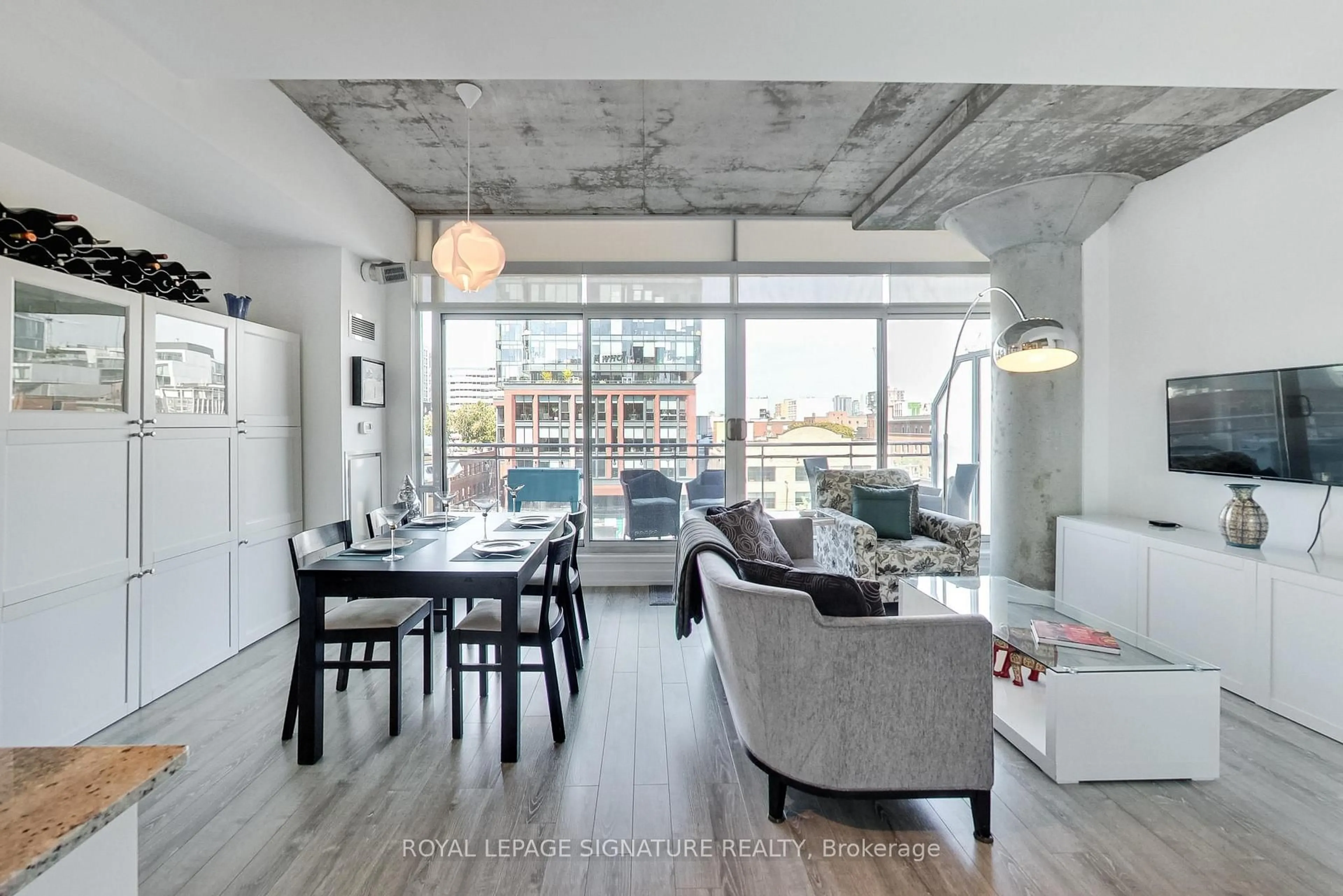 Living room with furniture, cement floor for 66 Portland St #610, Toronto Ontario M5V 2M6
