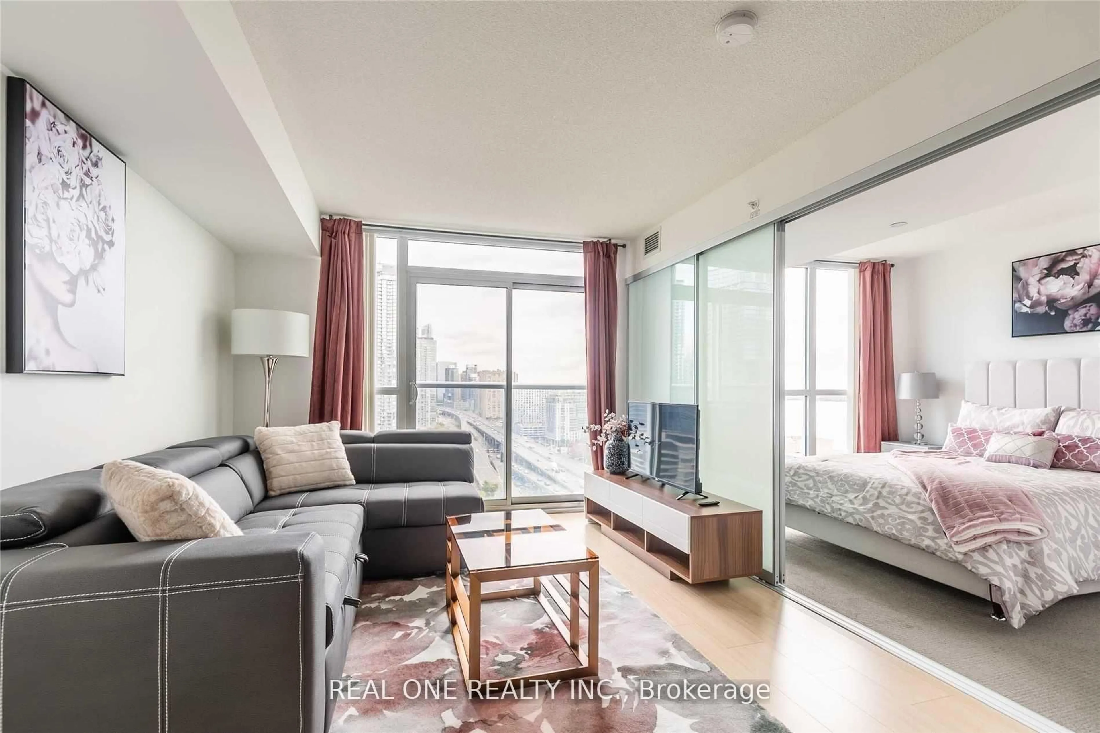 Living room with furniture, wood/laminate floor for 75 Queens Wharf Rd #2203, Toronto Ontario M5V 0J8