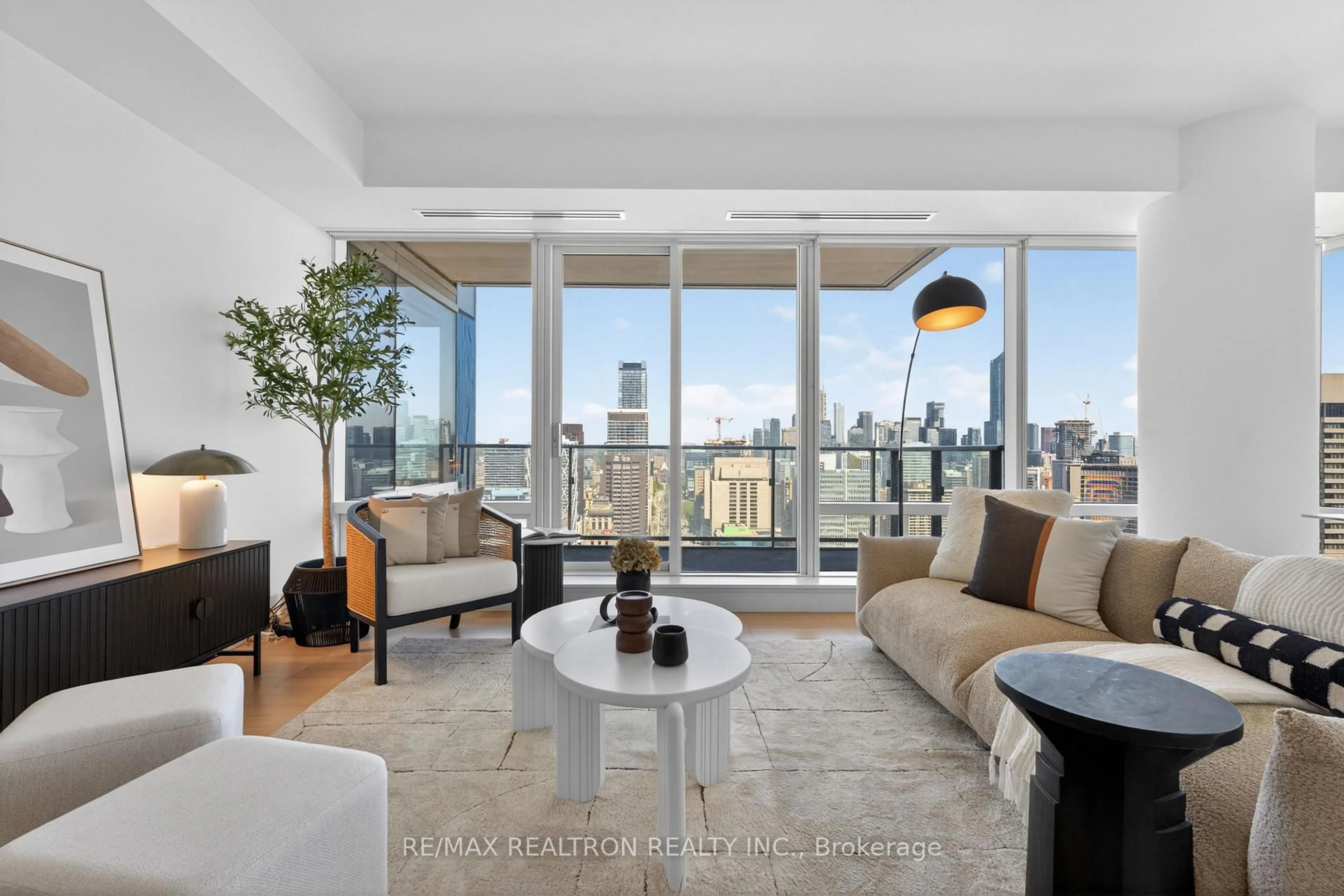 Living room with furniture, unknown for 180 University Ave #3906, Toronto Ontario M5H 0A2