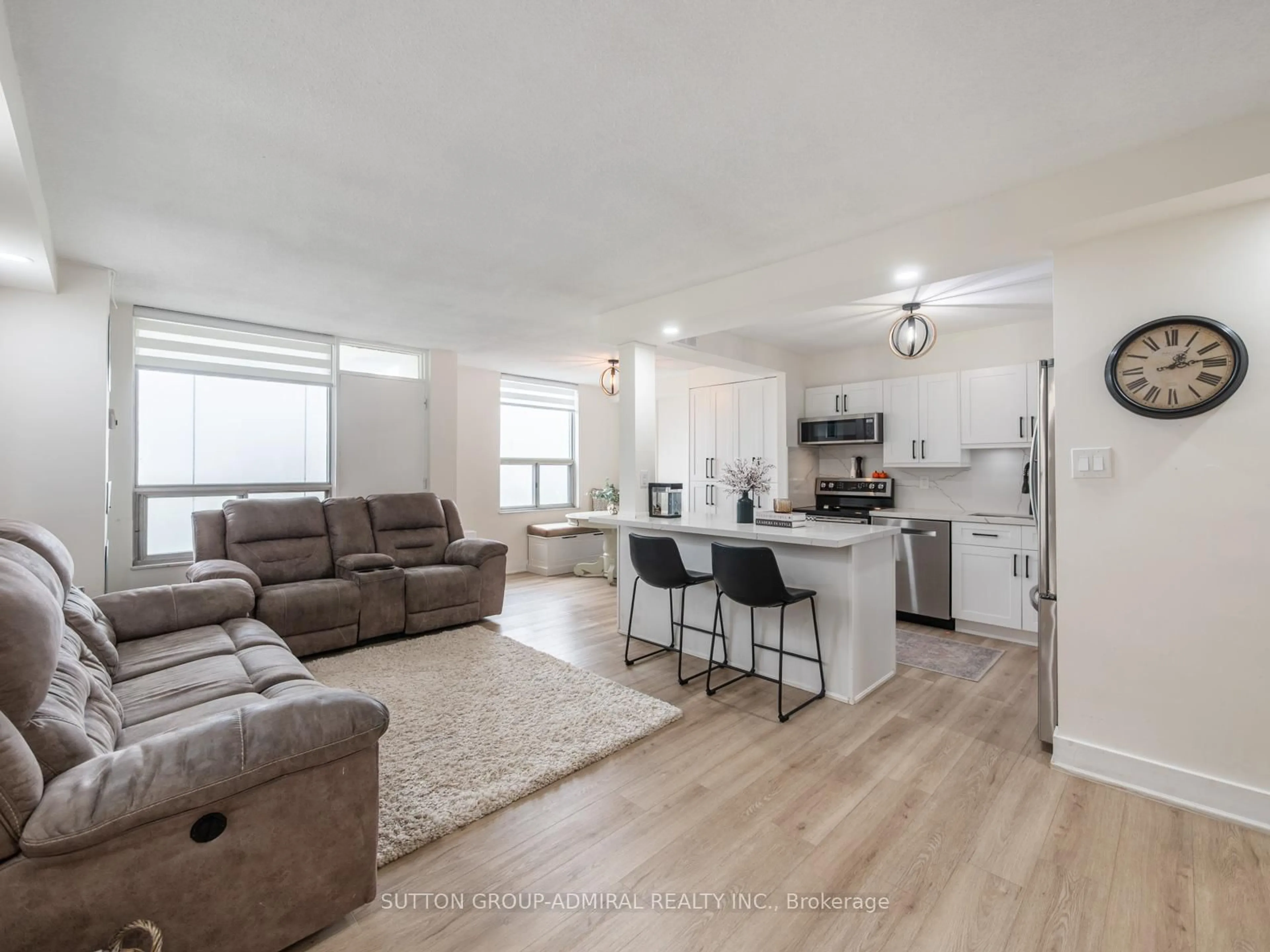 Living room with furniture, wood/laminate floor for 20 Edgecliff Gfwy #1603, Toronto Ontario M3C 3A4
