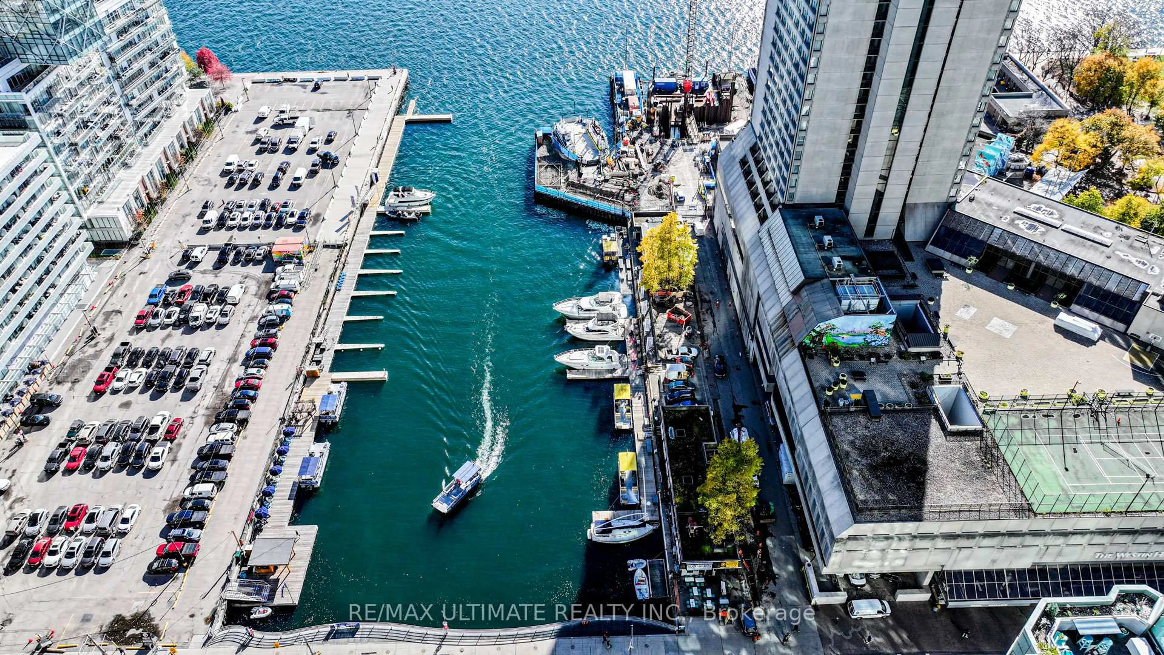 A pic from outside/outdoor area/front of a property/back of a property/a pic from drone, city buildings view from balcony for 10 Queens Quay #2206, Toronto Ontario M5J 2R9