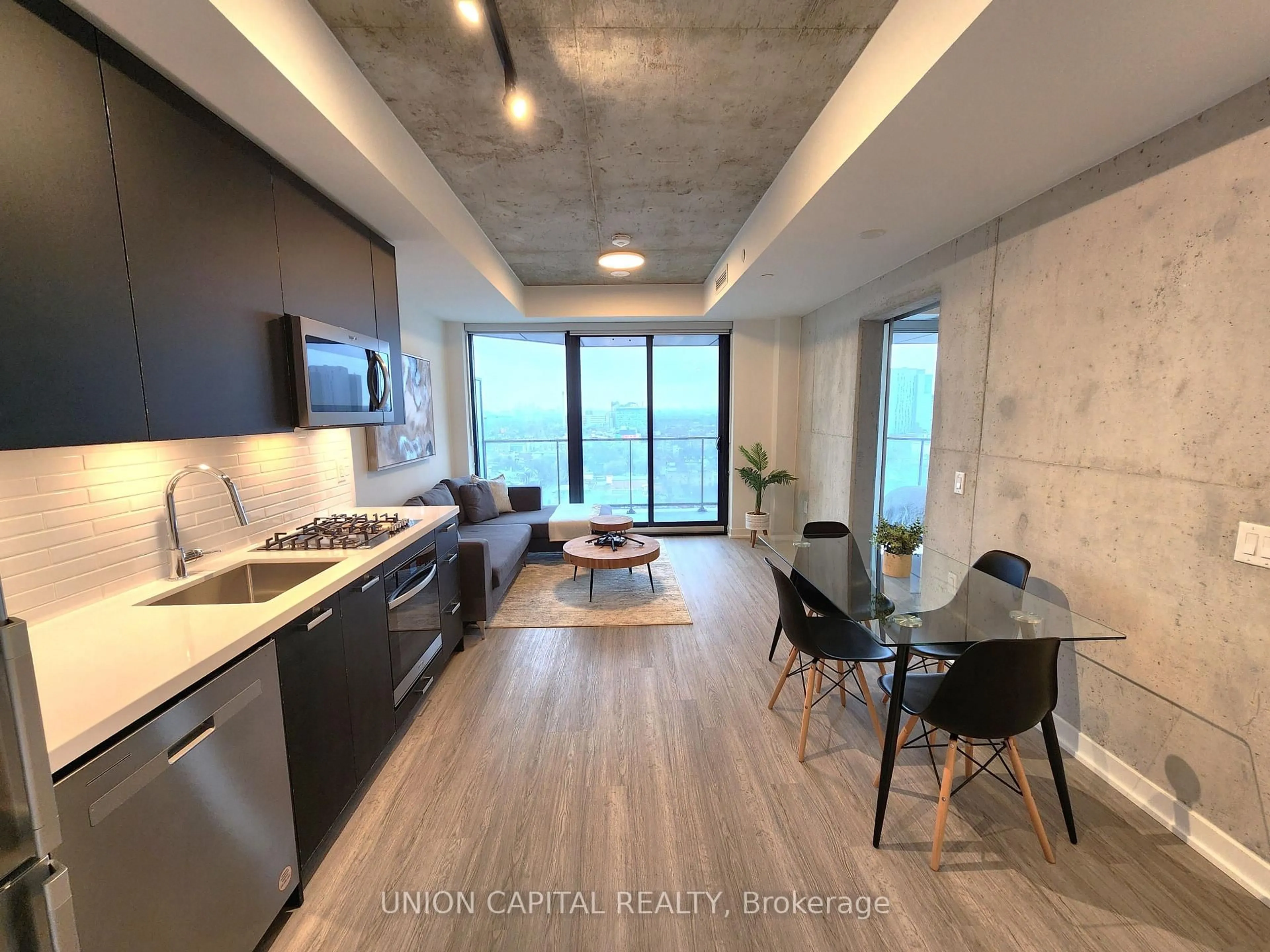 Open concept kitchen, cement floor for 195 McCaul St #1601, Toronto Ontario M5T 1W6