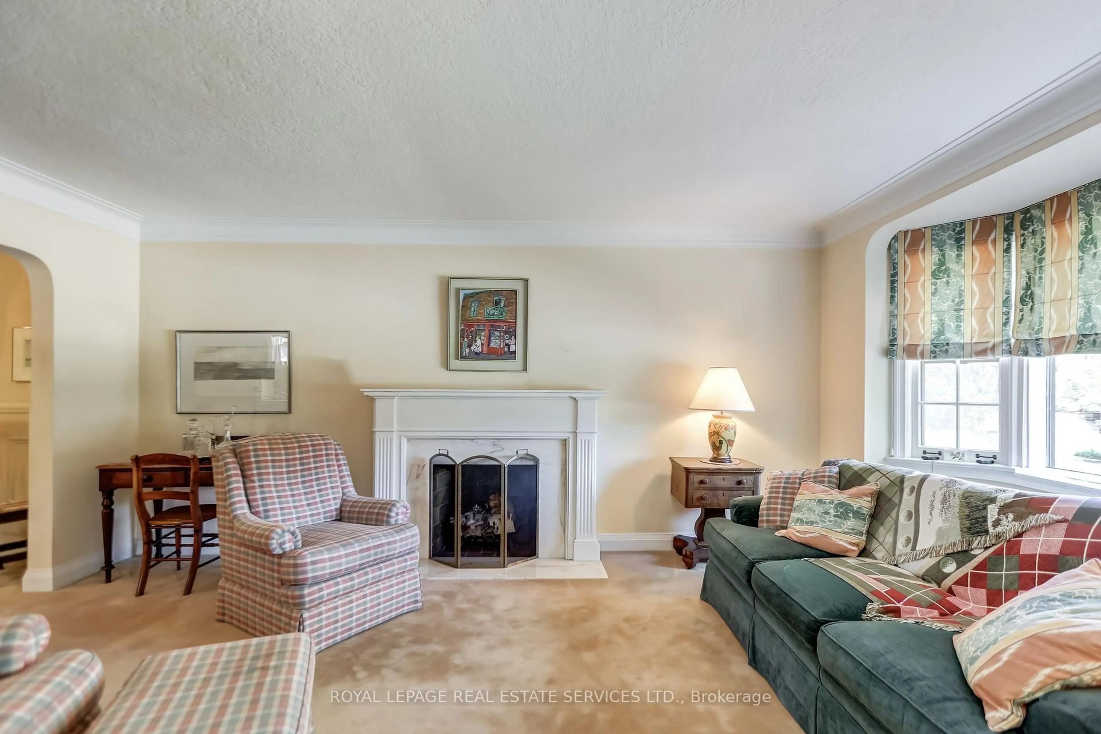 Living room with furniture, carpet floor for 24 Tanager Ave, Toronto Ontario M4G 3R1