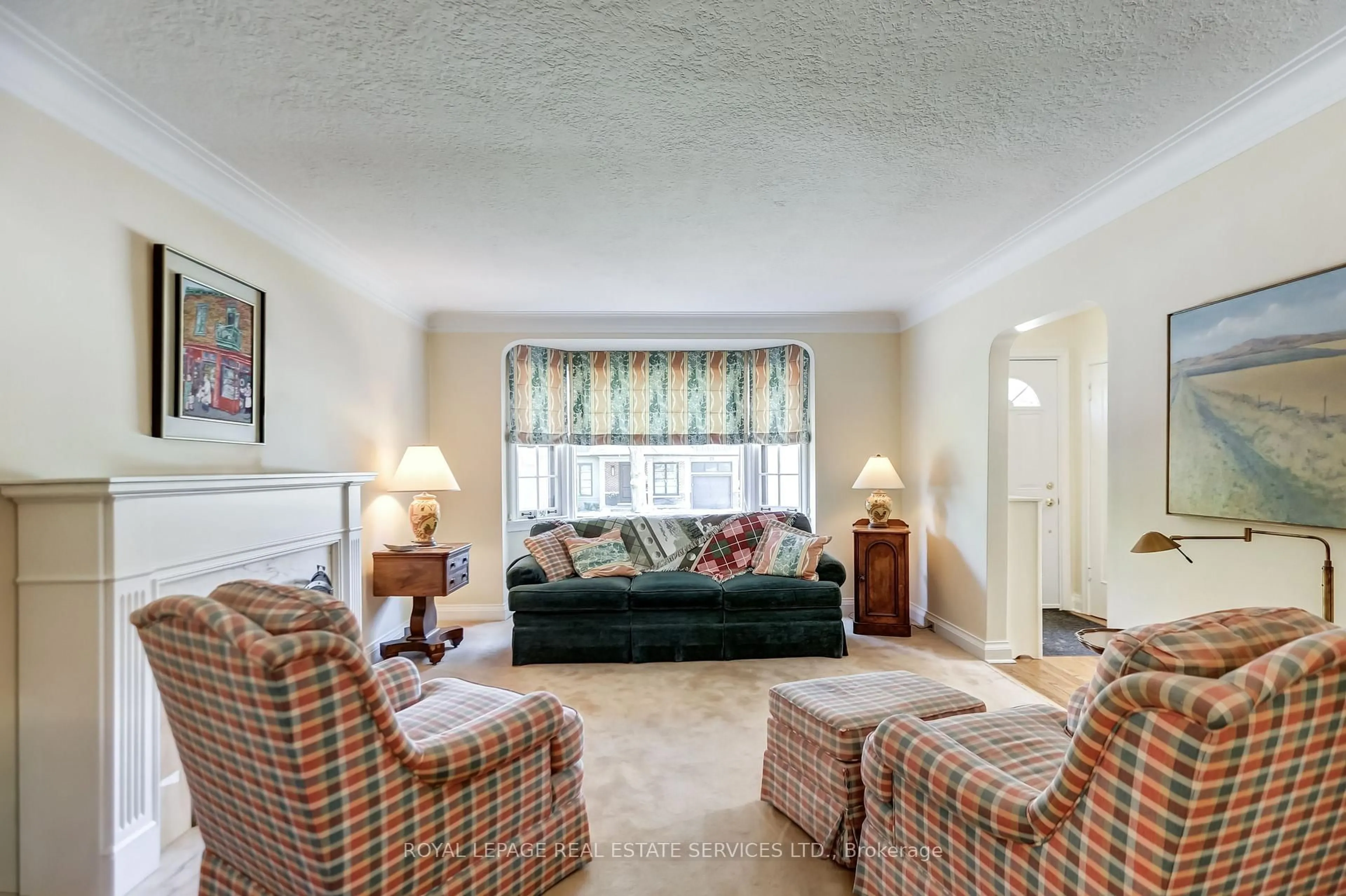 Living room with furniture, carpet floor for 24 Tanager Ave, Toronto Ontario M4G 3R1