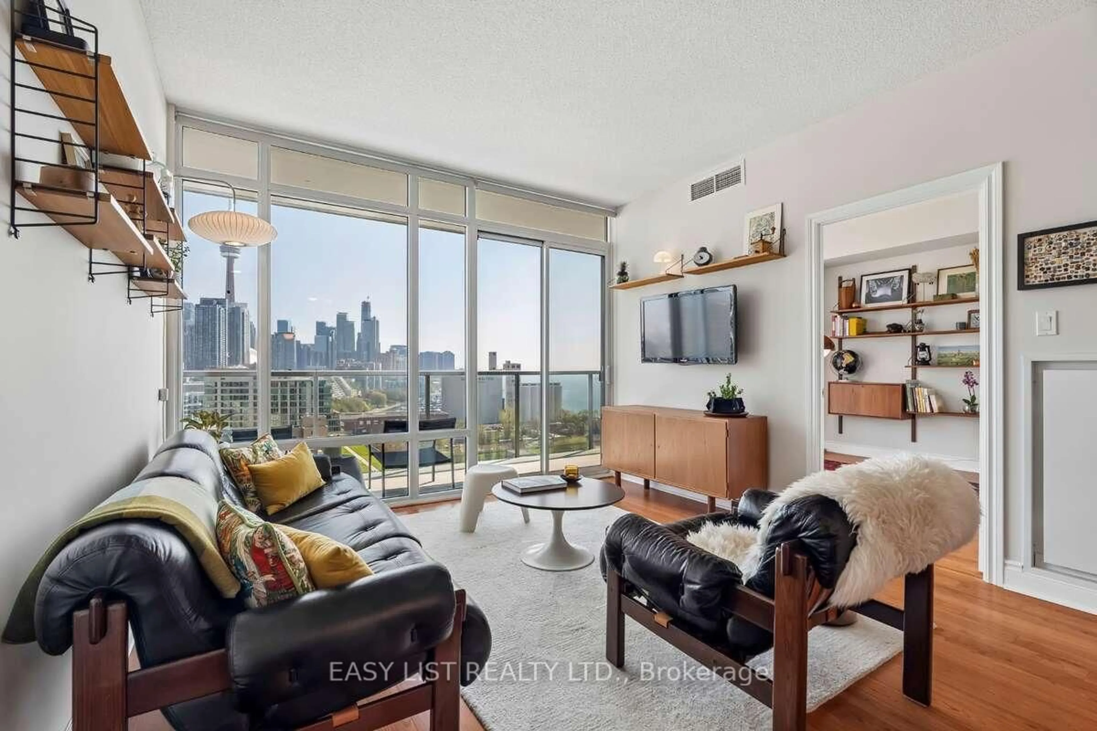 Living room with furniture, unknown for 90 Stadium Rd #1701, Toronto Ontario M5V 3W5
