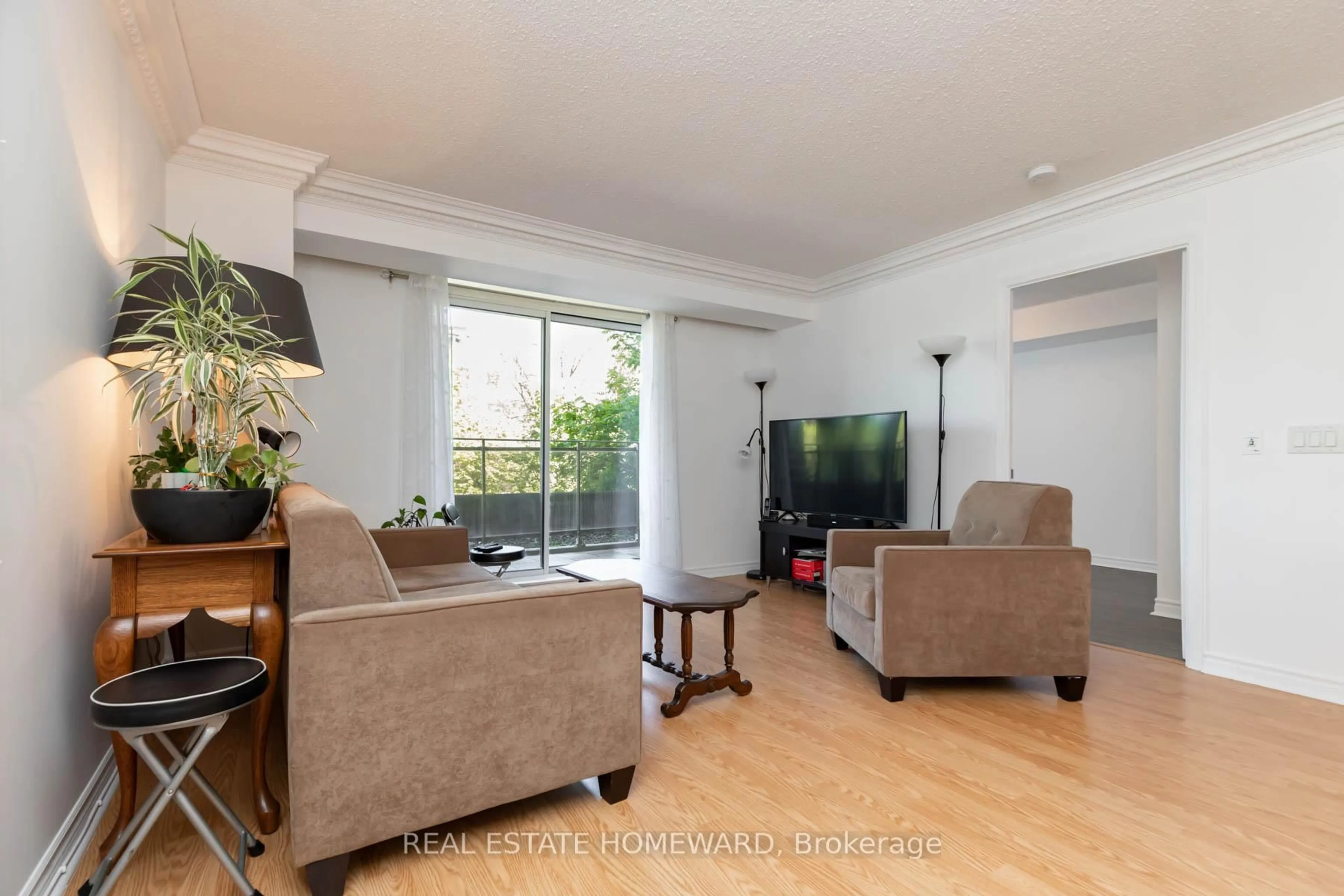 Living room with furniture, wood/laminate floor for 1730 Eglinton Ave #201, Toronto Ontario M4A 2X9