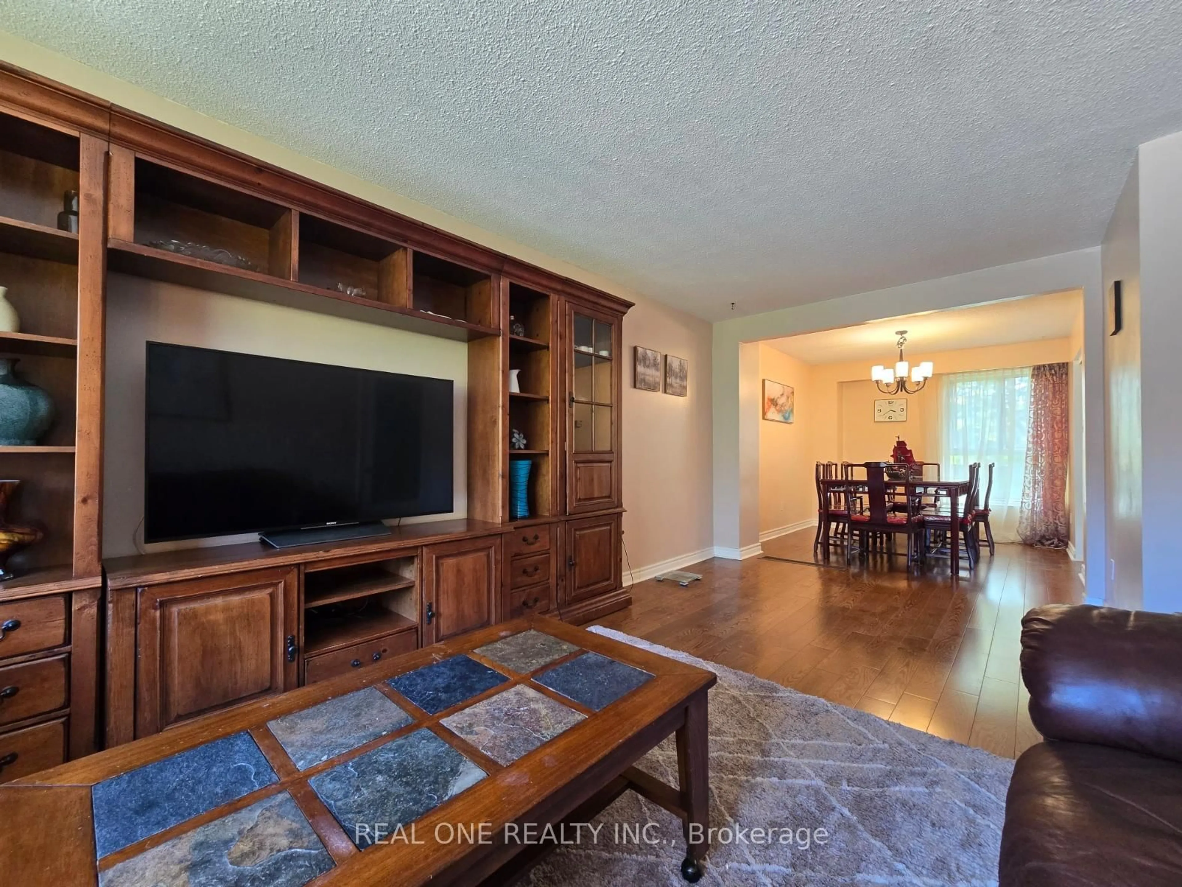 Living room with furniture, wood/laminate floor for 174 Rusty Crestway, Toronto Ontario M2J 2Y6
