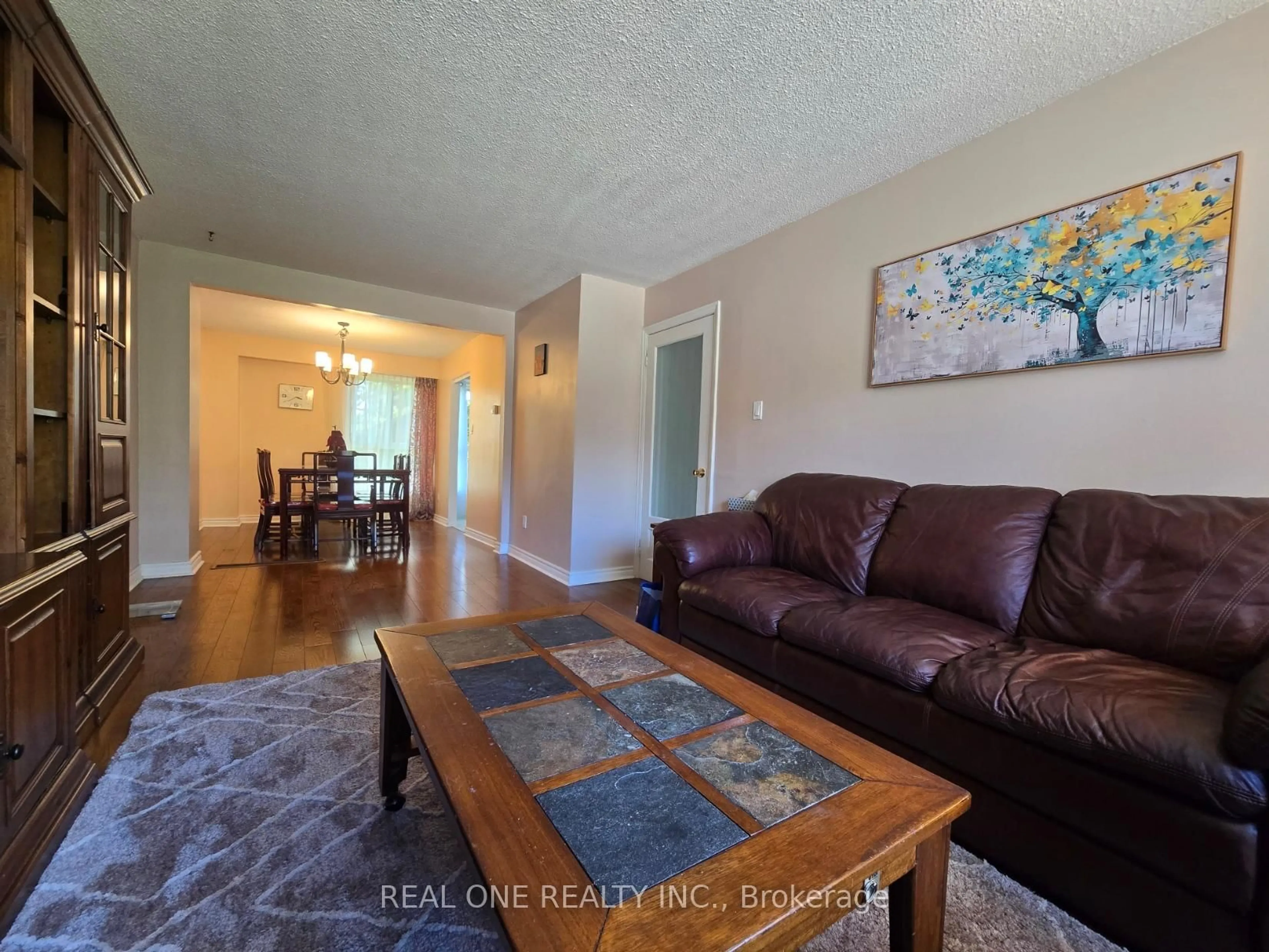 Living room with furniture, wood/laminate floor for 174 Rusty Crestway, Toronto Ontario M2J 2Y6