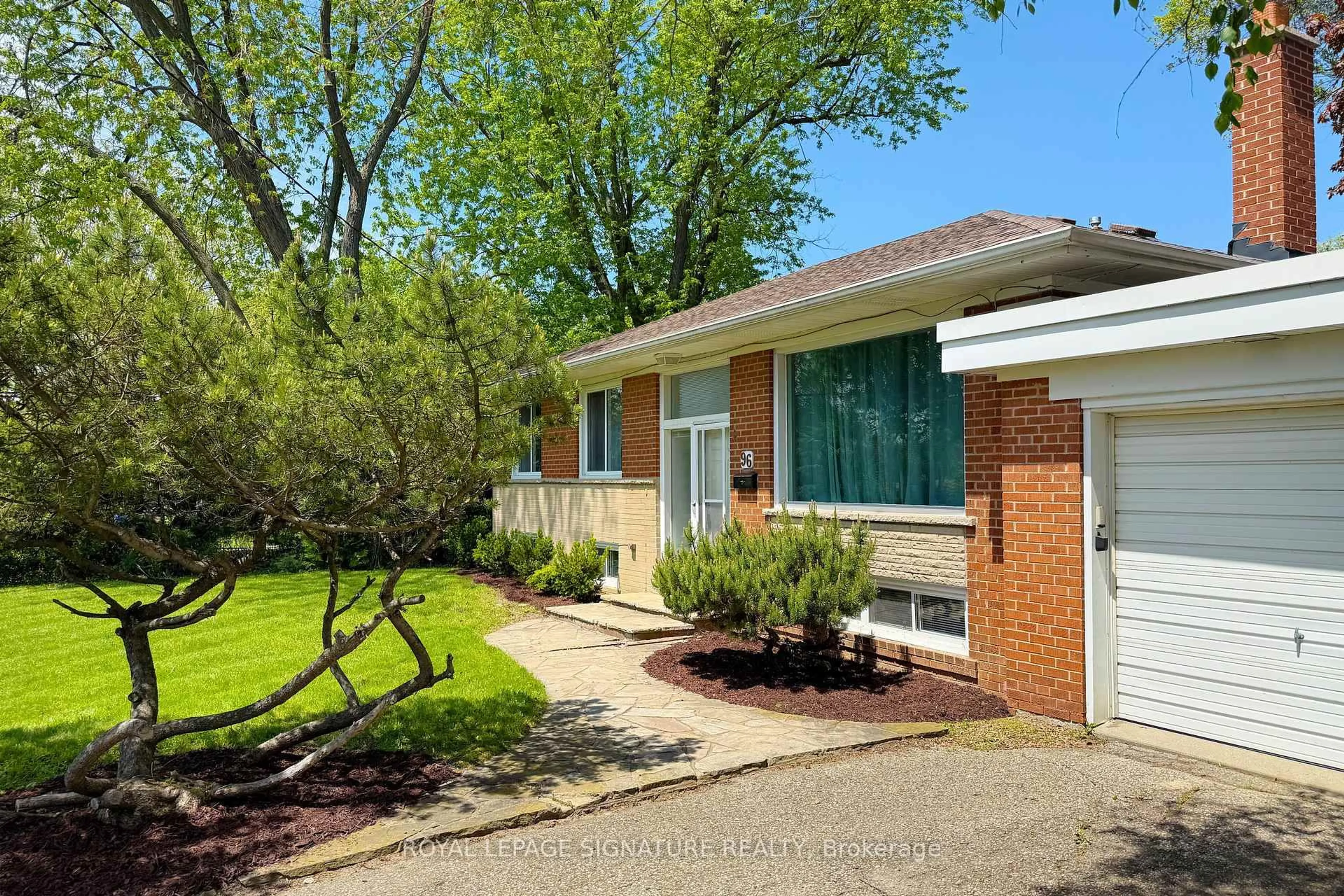 Home with brick exterior material, street for 96 Elvaston Dr, Toronto Ontario M4A 1N6