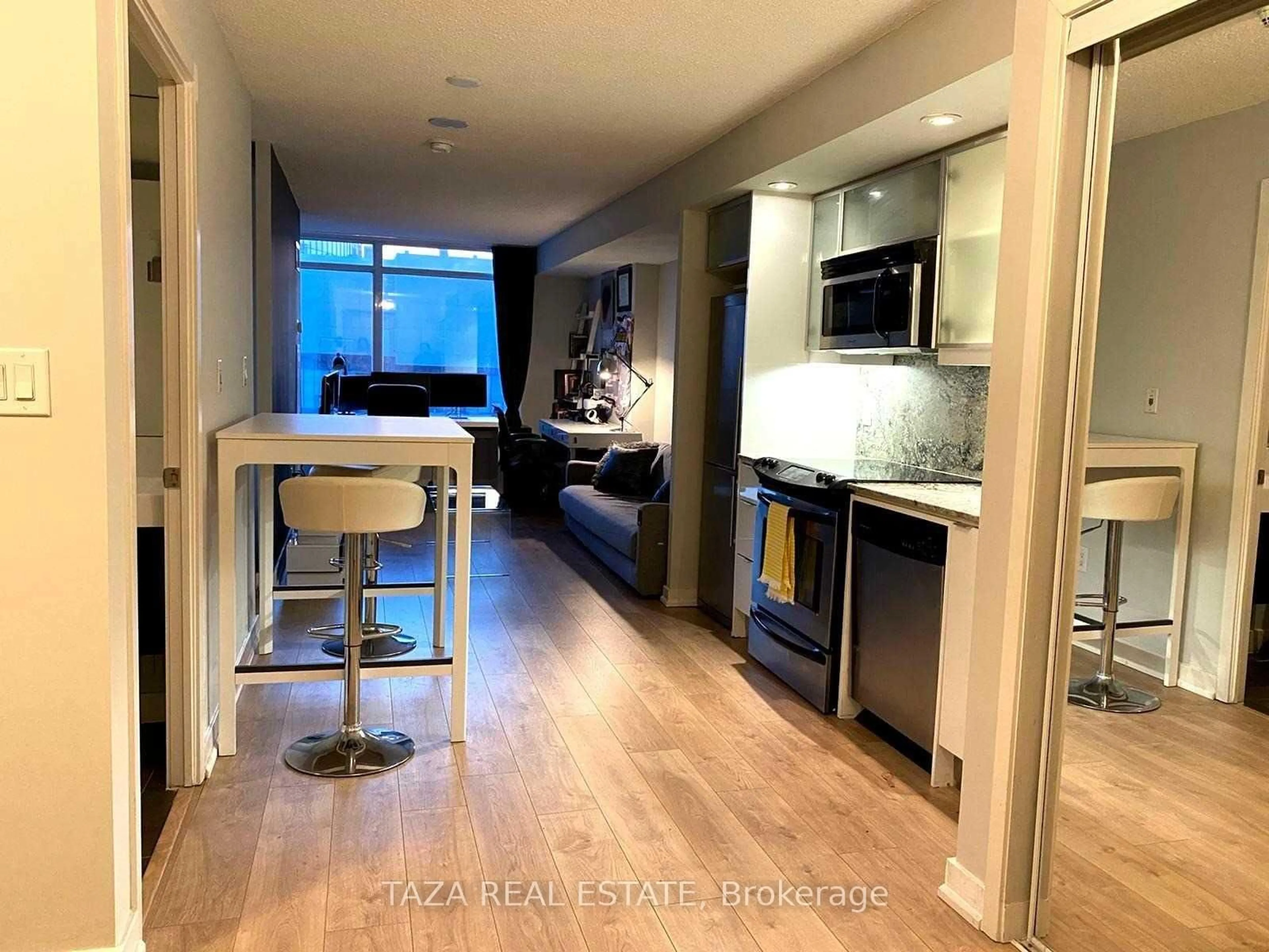 Open concept kitchen, wood/laminate floor for 25 Telegram Mews #4508, Toronto Ontario M5V 3Z1