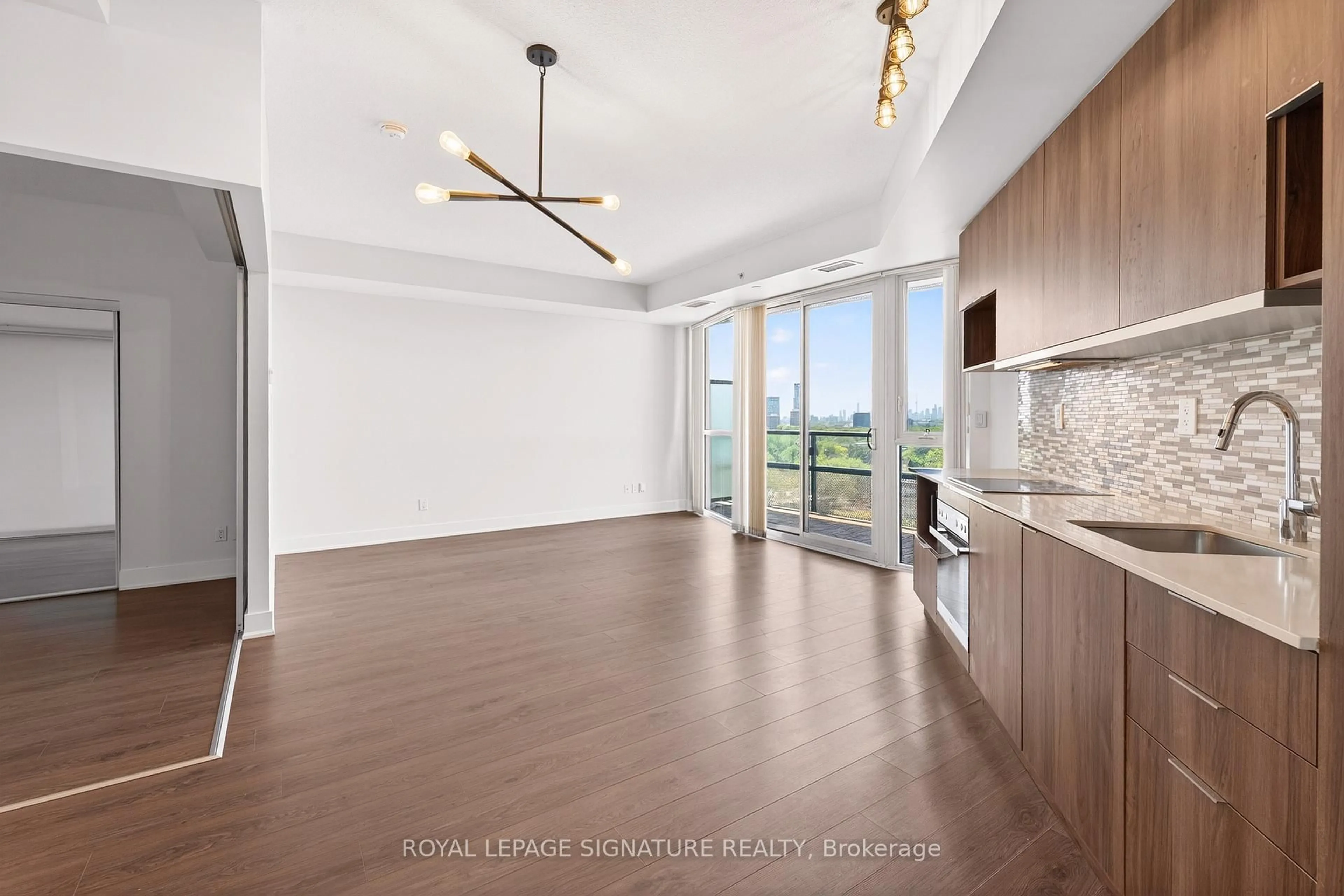 Open concept kitchen, wood/laminate floor for 99 The Donway #920, Toronto Ontario M3C 0N8