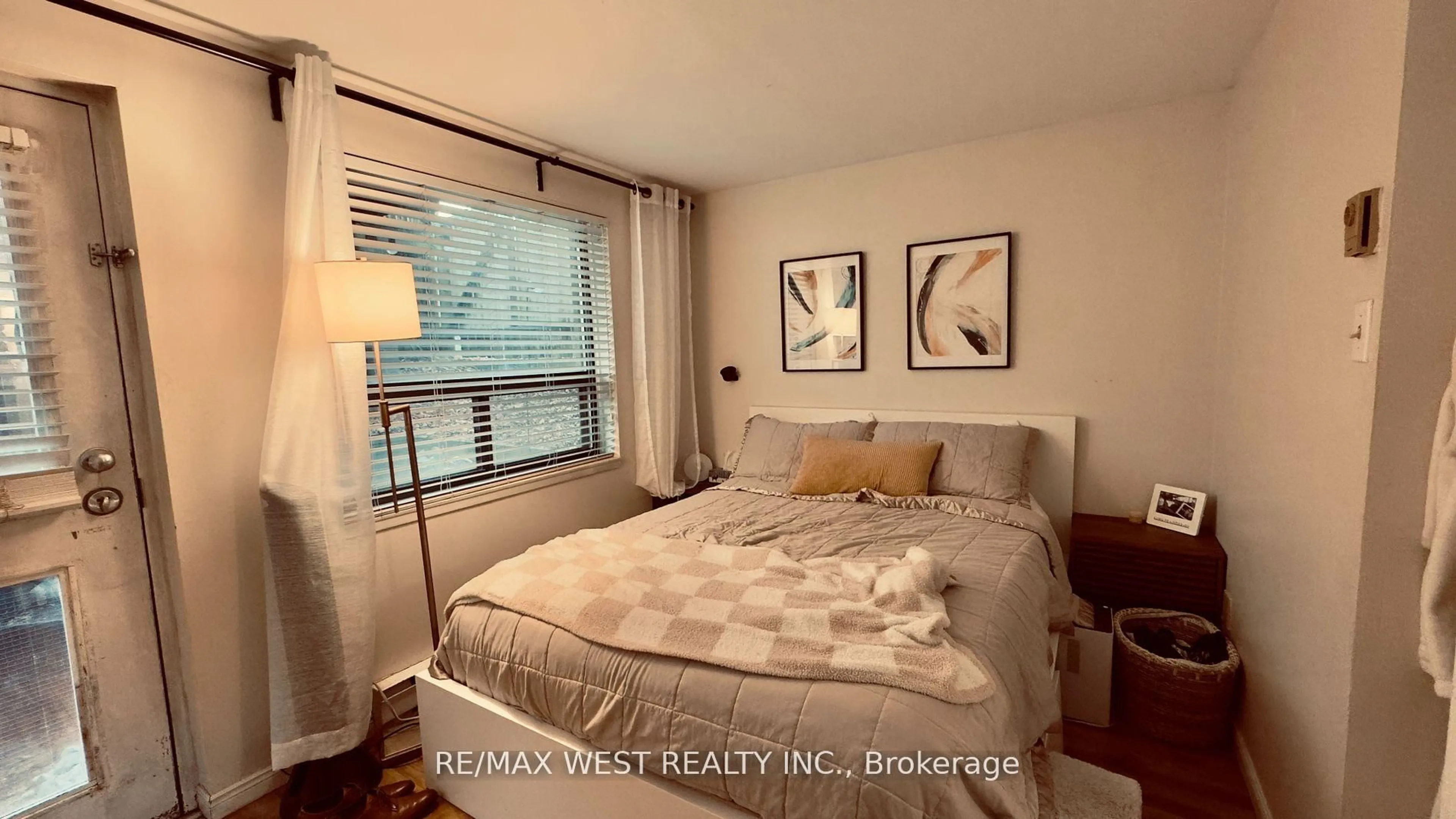 Bedroom with bed, wood/laminate floor for 1061 Bathurst St, Toronto Ontario M5R 3G8